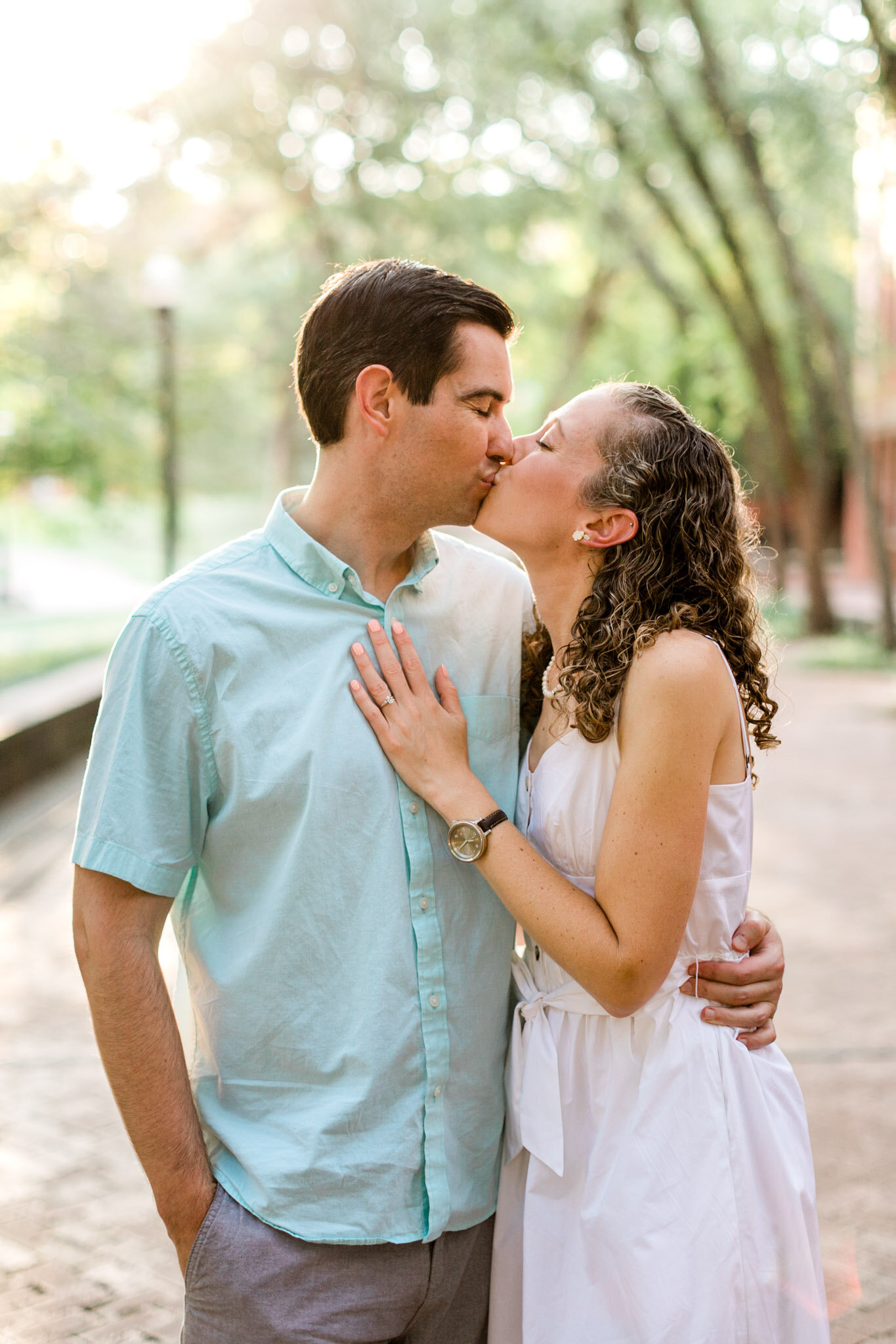 Raleigh Engagement Photographer | NC State University | By G. Lin Photography | Couple kissing outdoors during golden hour