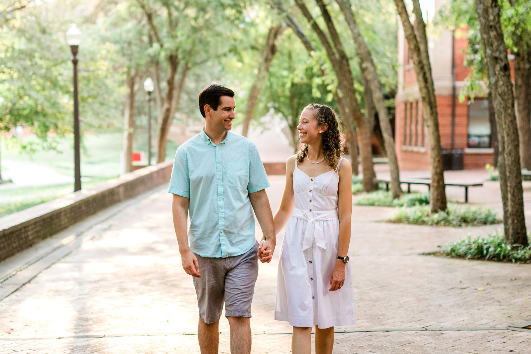 Raleigh Engagement Photographer | NC State University | By G. Lin Photography |  Couple walking around NC State campus