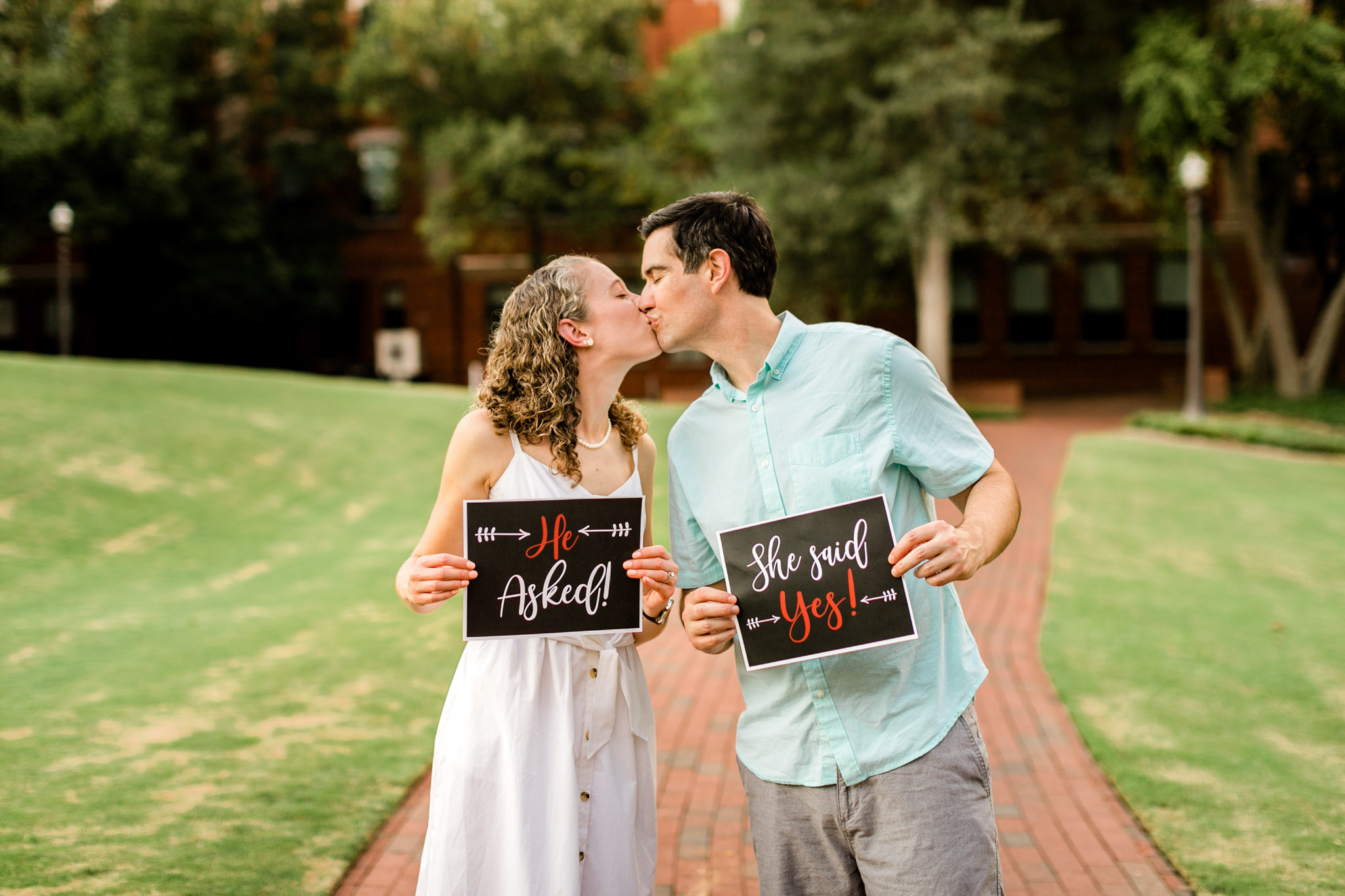 Raleigh Engagement Photographer | NC State University | By G. Lin Photography | He asked she said yes with couple kissing