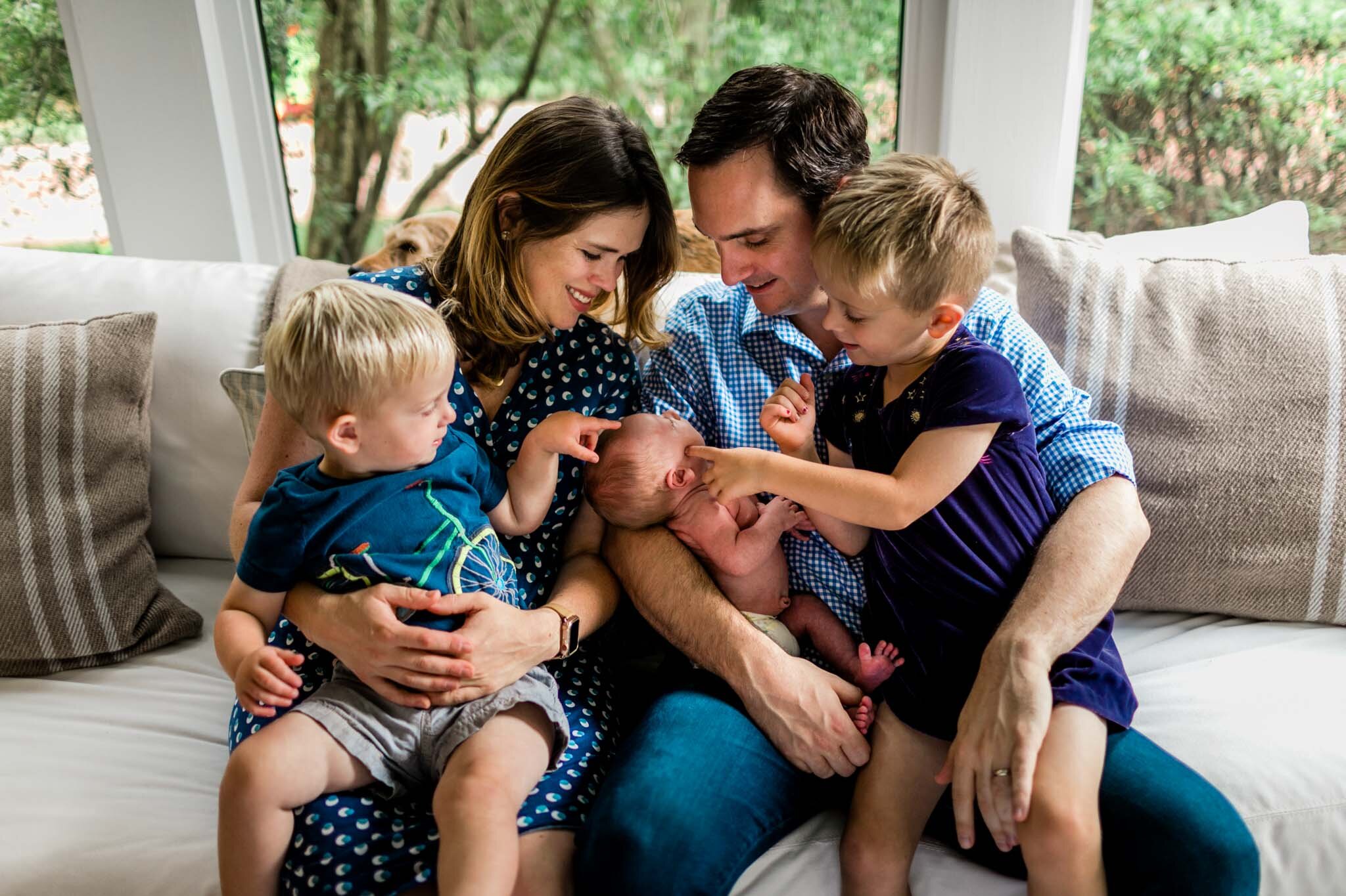 Durham Newborn Photographer | By G. Lin Photography | Family of five sitting on sofa with newborn