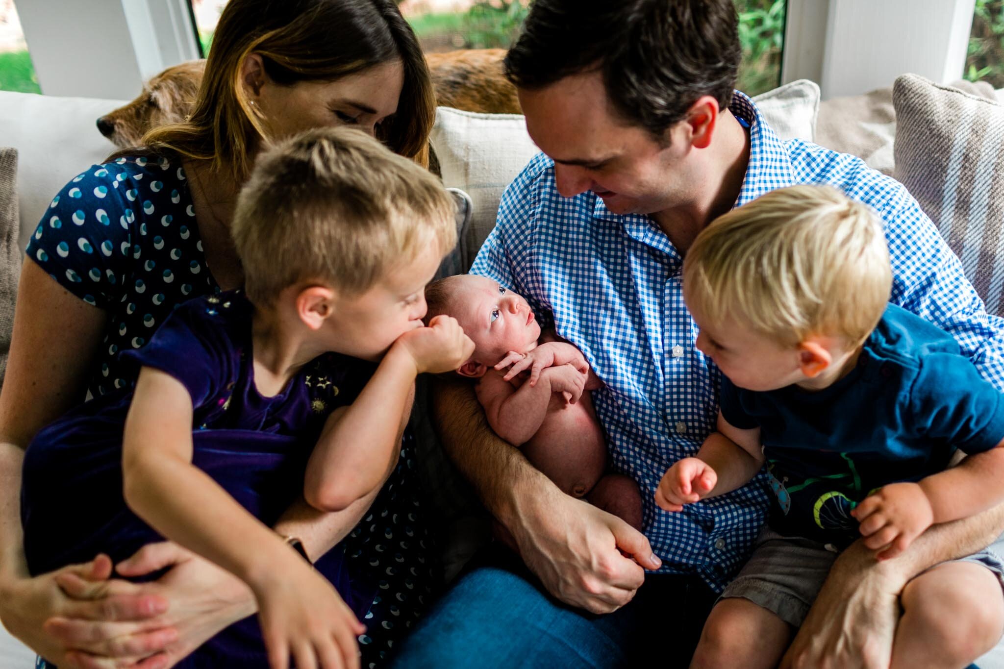 Durham Newborn Photographer | By G. Lin Photography | Family members looking at newborn baby brother