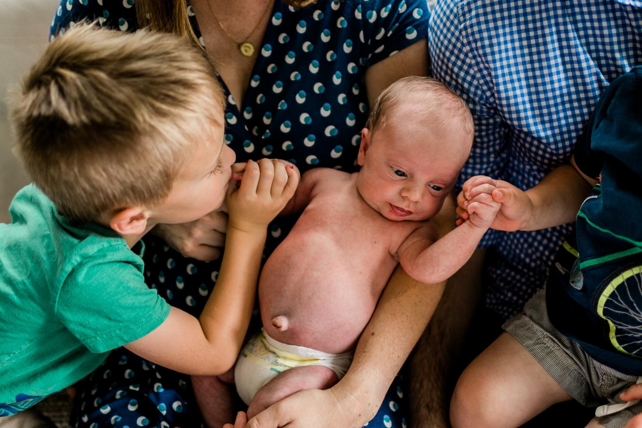 Durham Newborn Photographer | By G. Lin Photography | Sibling kissing brother's hand