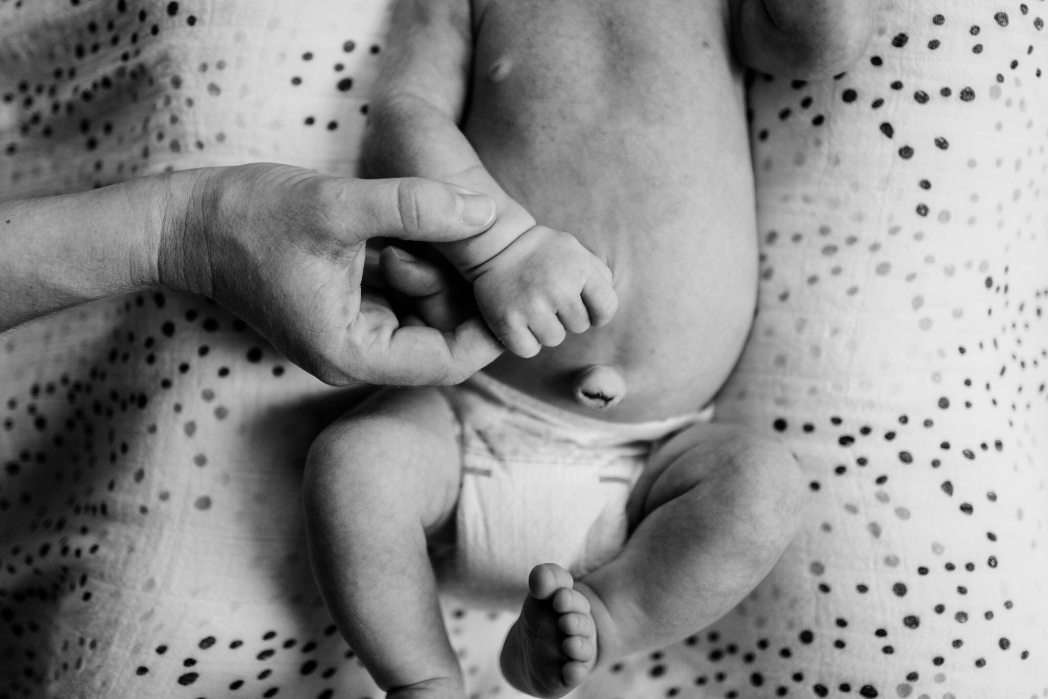 Durham Newborn Photographer | By G. Lin Photography | Mother holding baby's hand
