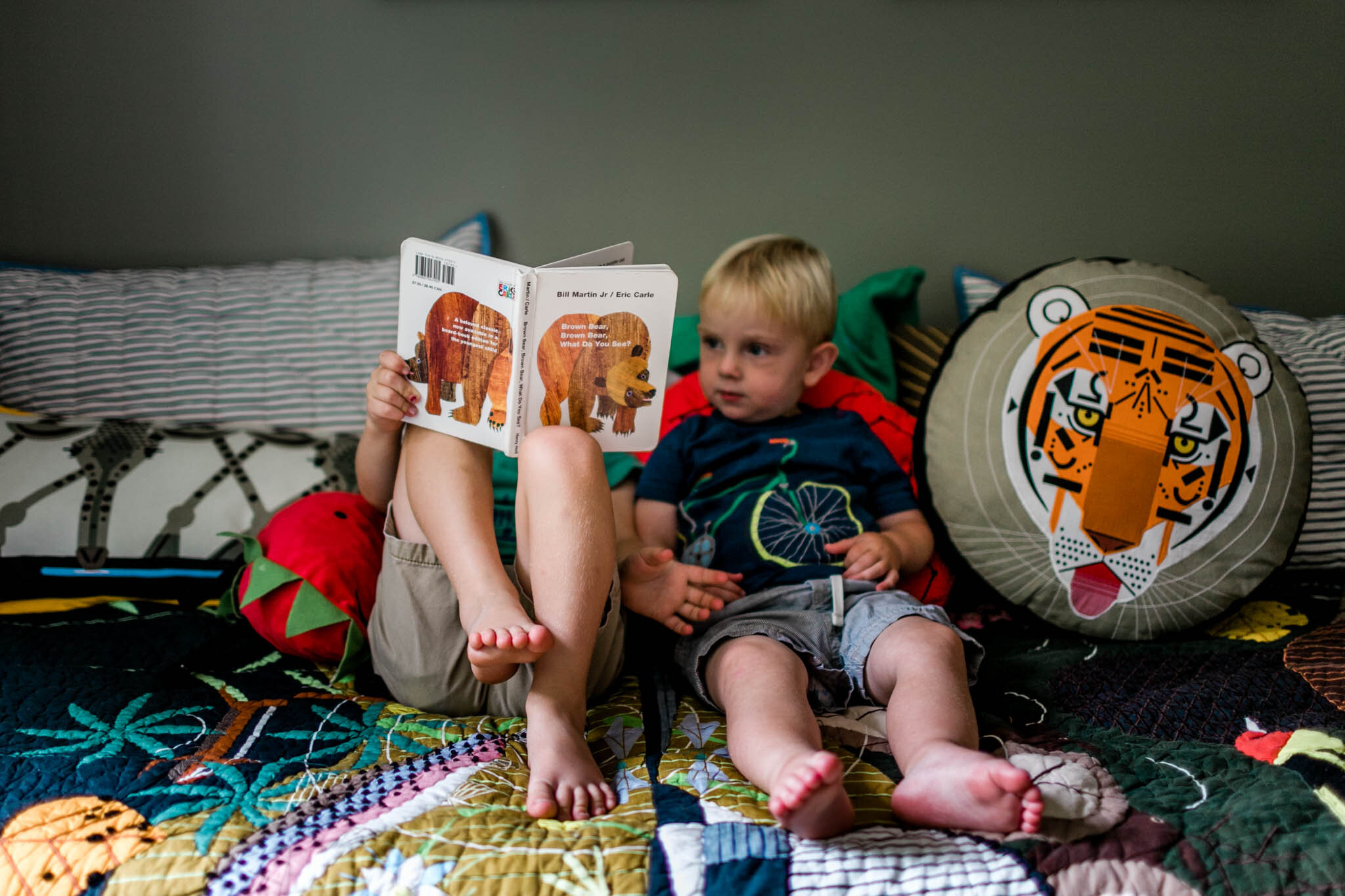 Durham Newborn Photographer | By G. Lin Photography | Older brother reading book to sibling