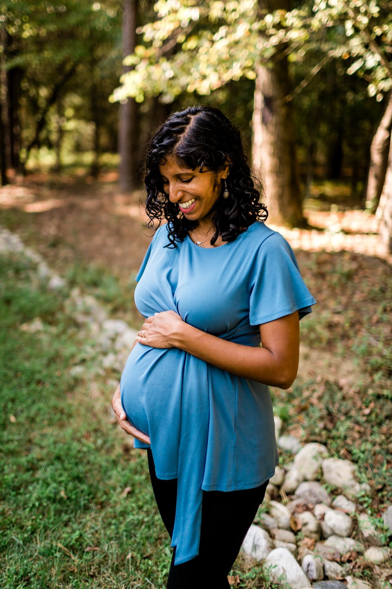 Raleigh Maternity Photographer | By G. Lin Photography | Pregnant woman with hands on baby belly