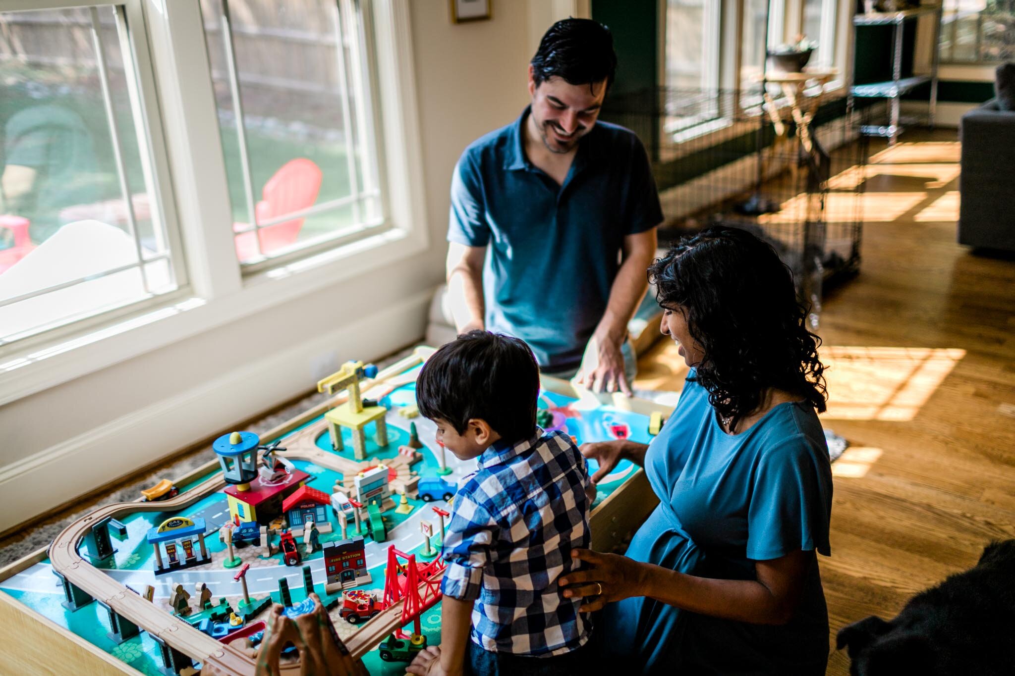 Durham Photographer | By G. Lin Photography | Family playing with train set indoors