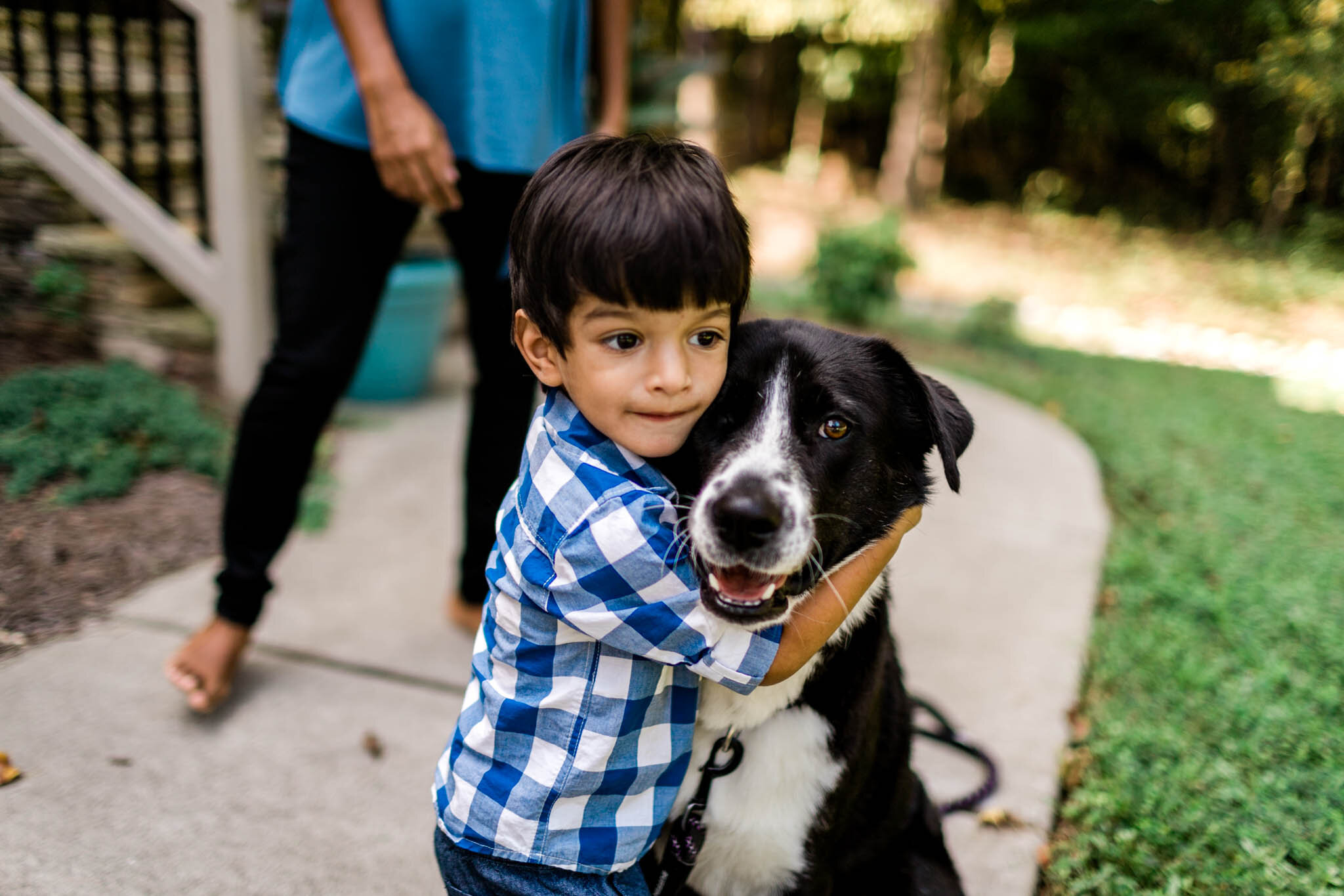 Young toddler hugging dog | Durham Family Photographer | By G. Lin Photography