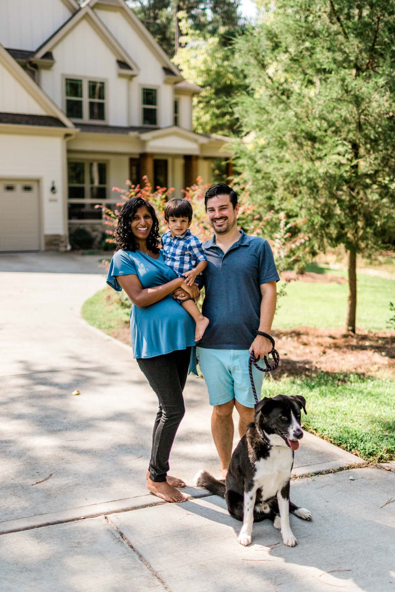 Durham Photographer | By G. Lin Photography | Family standing outside of home and smiling