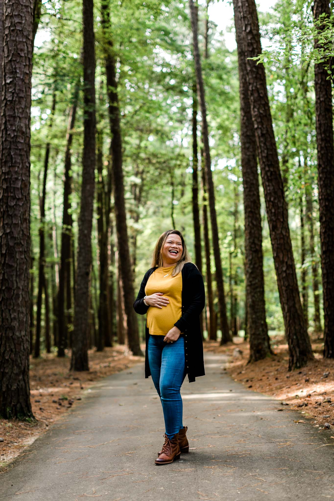 Maternity Portrait at Umstead Park | Woman laughing and holding baby belly | Raleigh Maternity Photographer | By G. Lin Photography