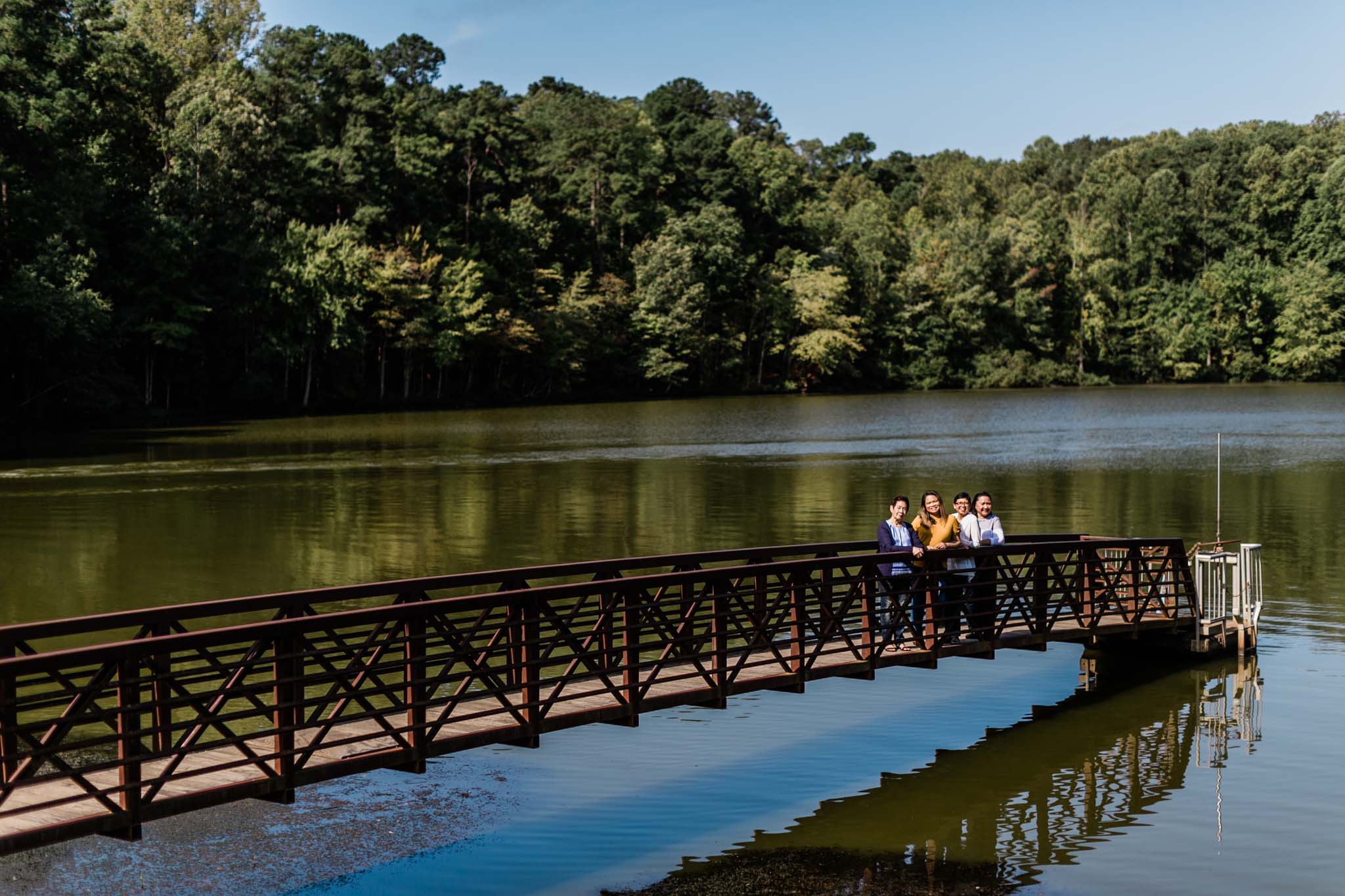 Family photo on dock at Umstead Park | Raleigh Photographer | By G. Lin Photography