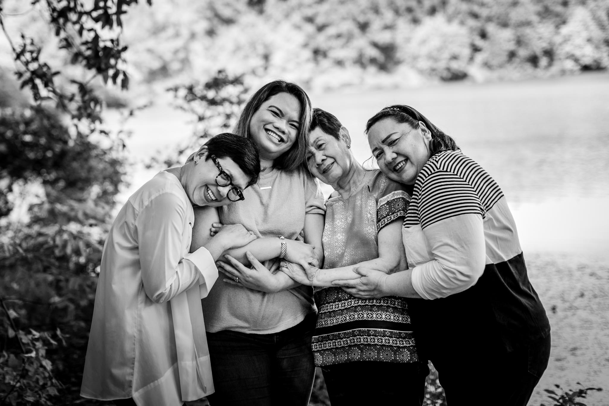 Raleigh Family Photographer | By G. Lin Photography | Black and white photo of four women by the water