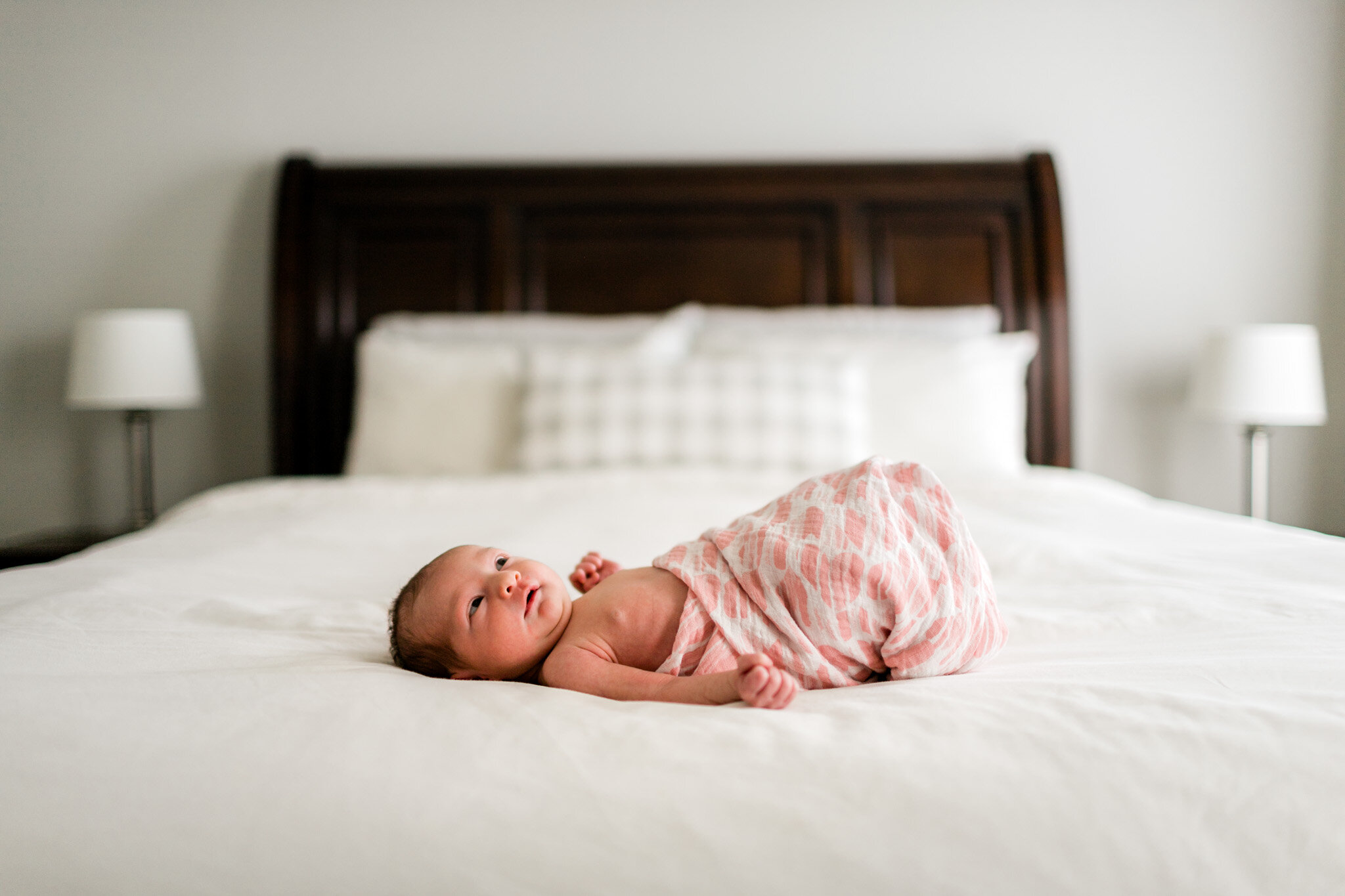 Durham Newborn Photographer | By G. Lin Photography | Baby girl laying on white bed sheets
