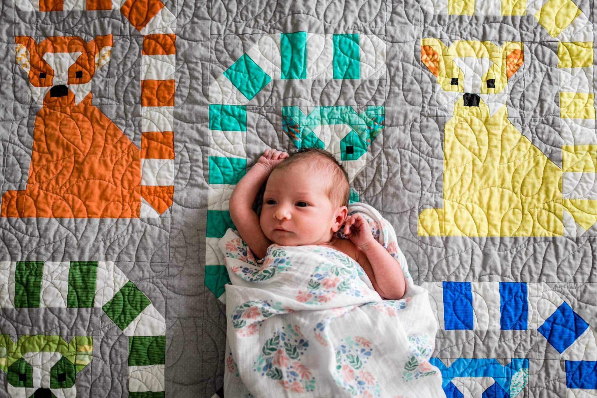 Raleigh Newborn Photographer | By G. Lin Photography | Baby girl laying on quilt