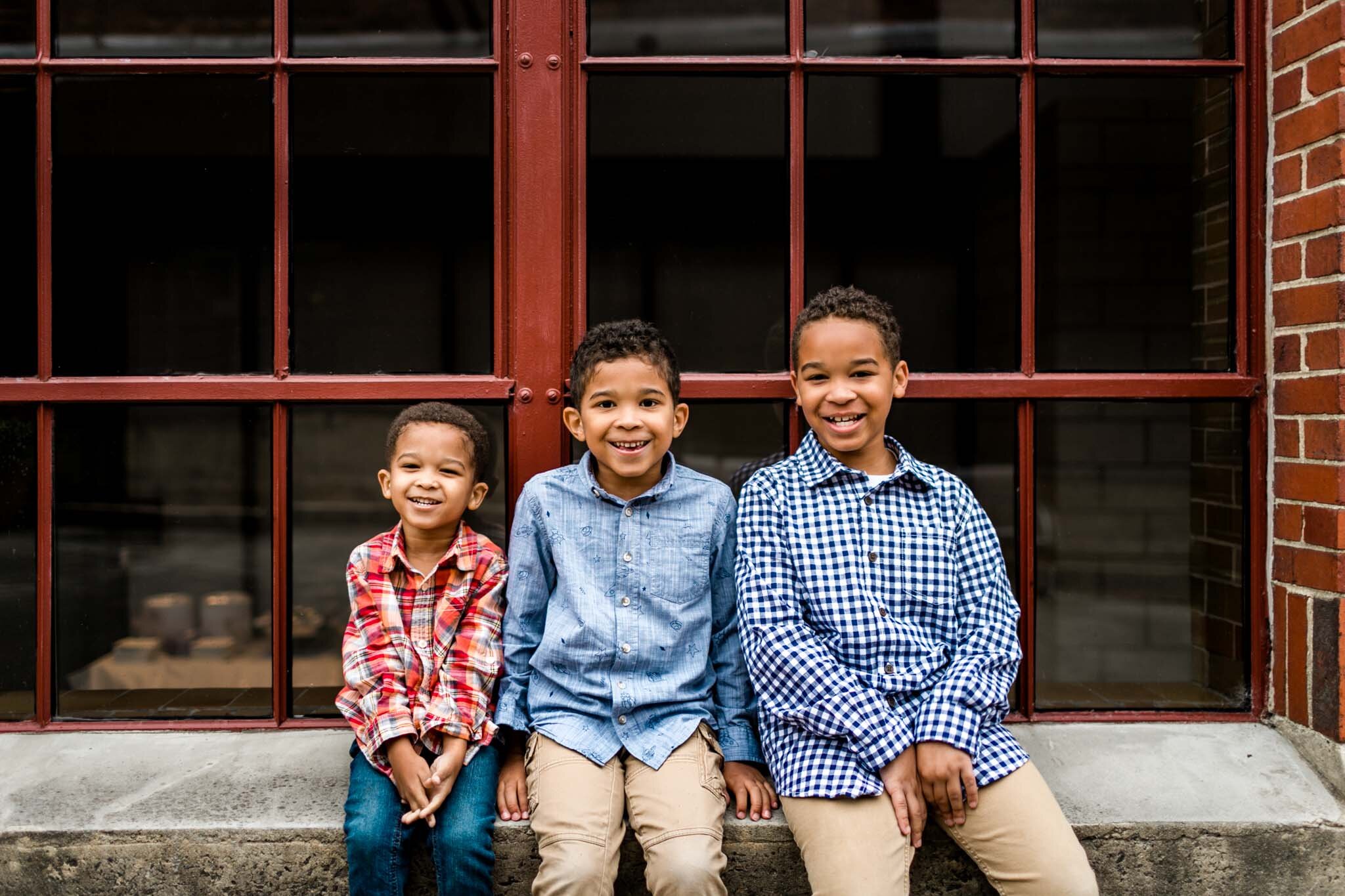 Three brothers sitting on window sill | Durham Family Photographer | By G. Lin Photography | Urban Family Photography