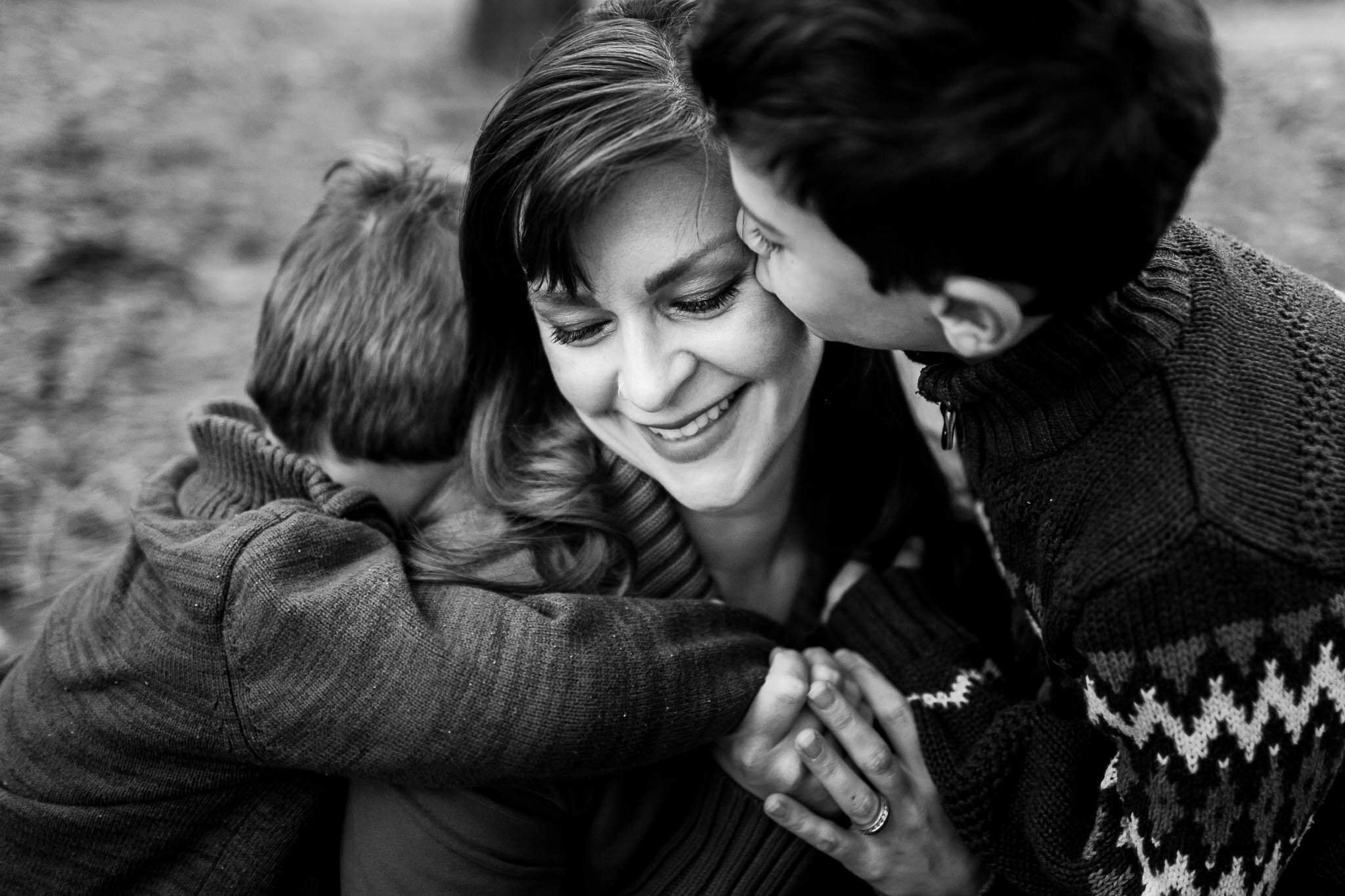 Raleigh Family Photographer | By G. Lin Photography | Two sons kissing and hugging mom