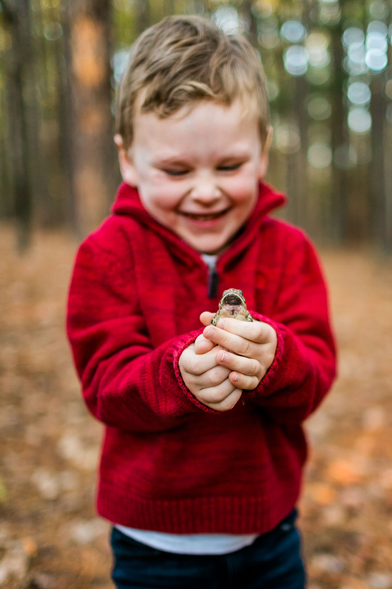Raleigh Family Photographer | By G. Lin Photography | Toad jumping from boy's hands