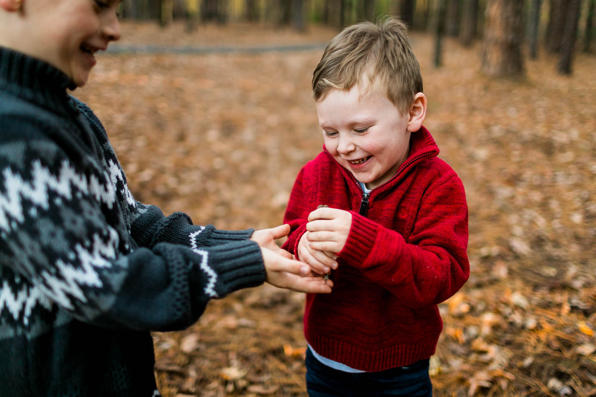 Raleigh Family Photographer | By G. Lin Photography | Candid photo of boys holding toad