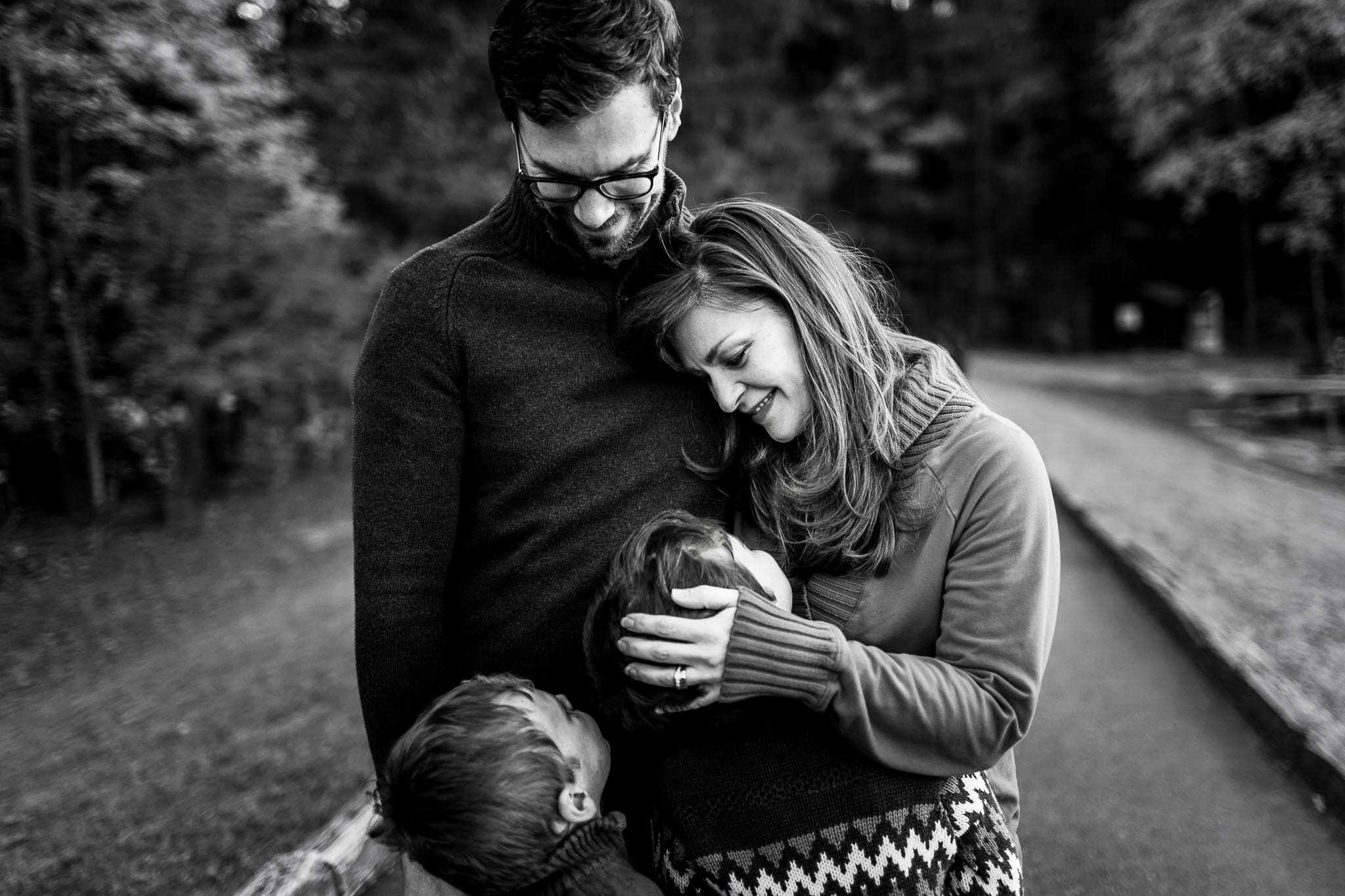 Raleigh Family Photographer | By G. Lin Photography | Beautiful black and white photo of family hugging one another