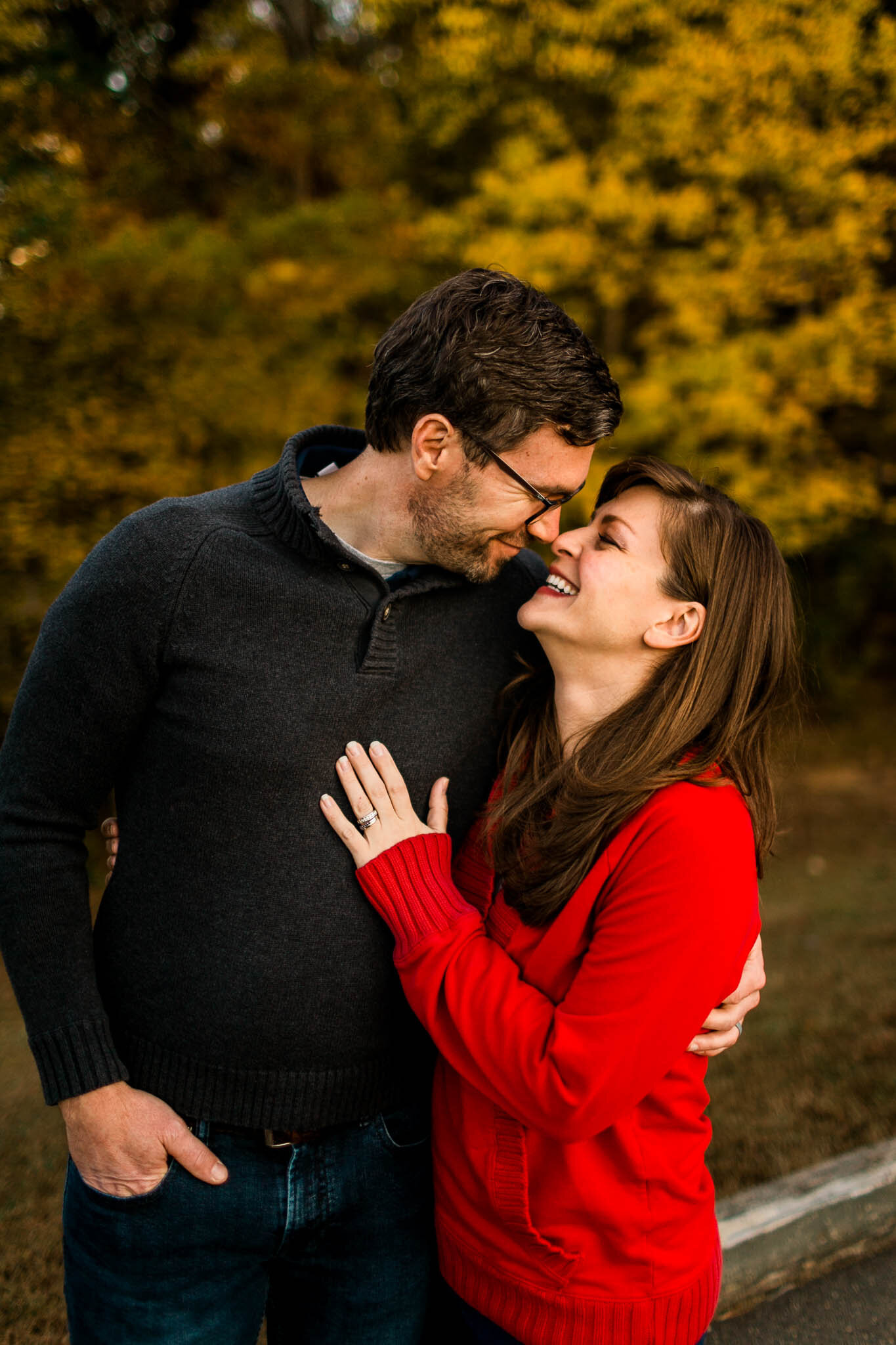 Raleigh Family Photographer | By G. Lin Photography | Couple embracing one another at Umstead Park during sunset