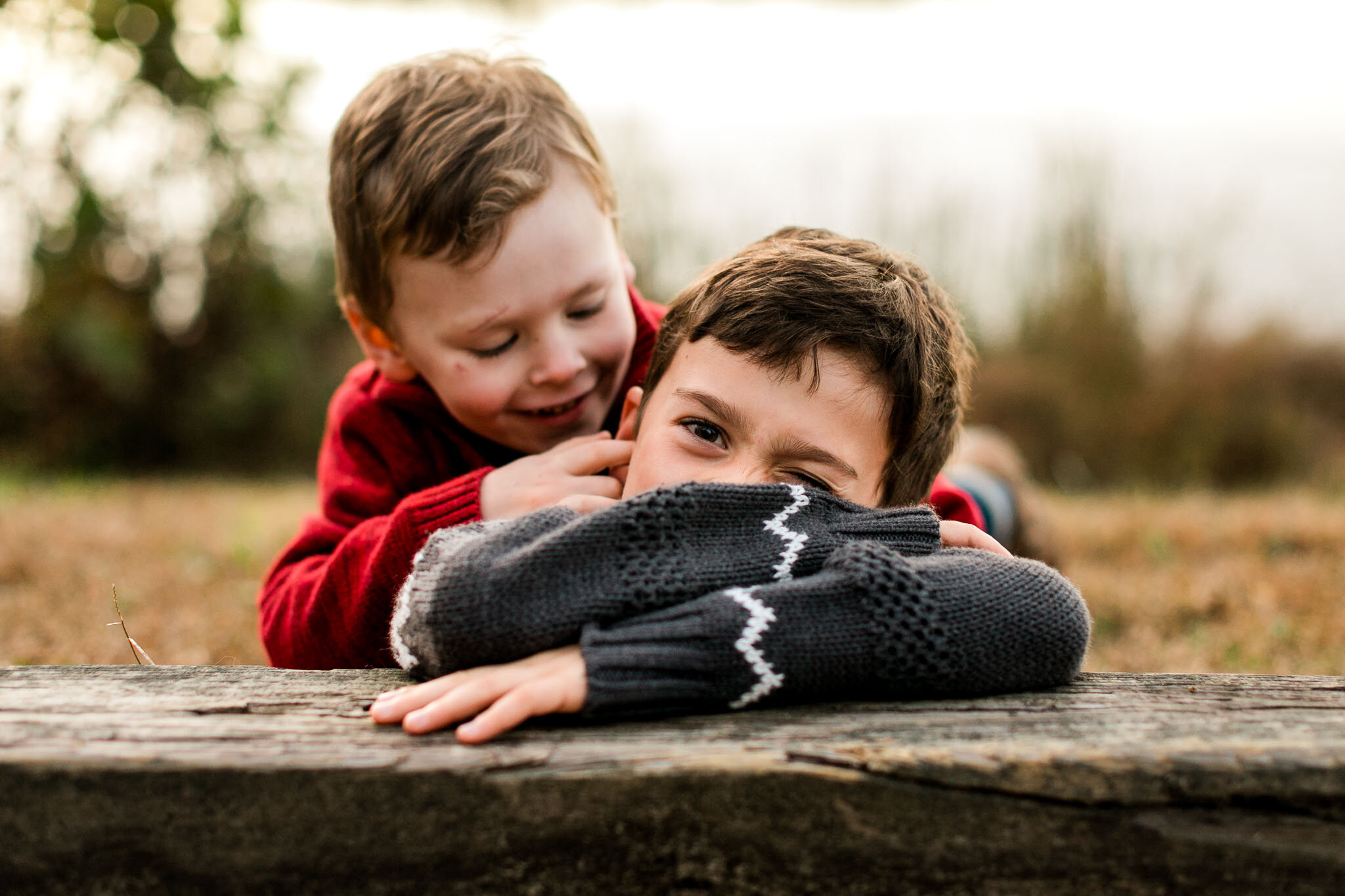 Raleigh Family Photographer | By G. Lin Photography | Silly candid photo of boys on the grass
