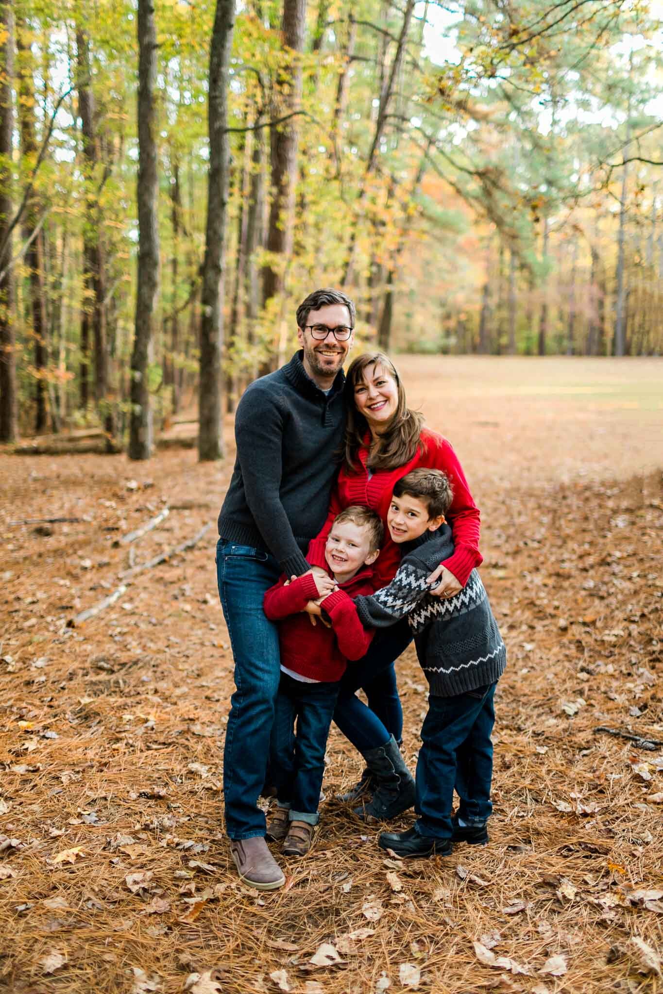 Raleigh Family Photographer | By G. Lin Photography | Family hugging each other at outdoor park