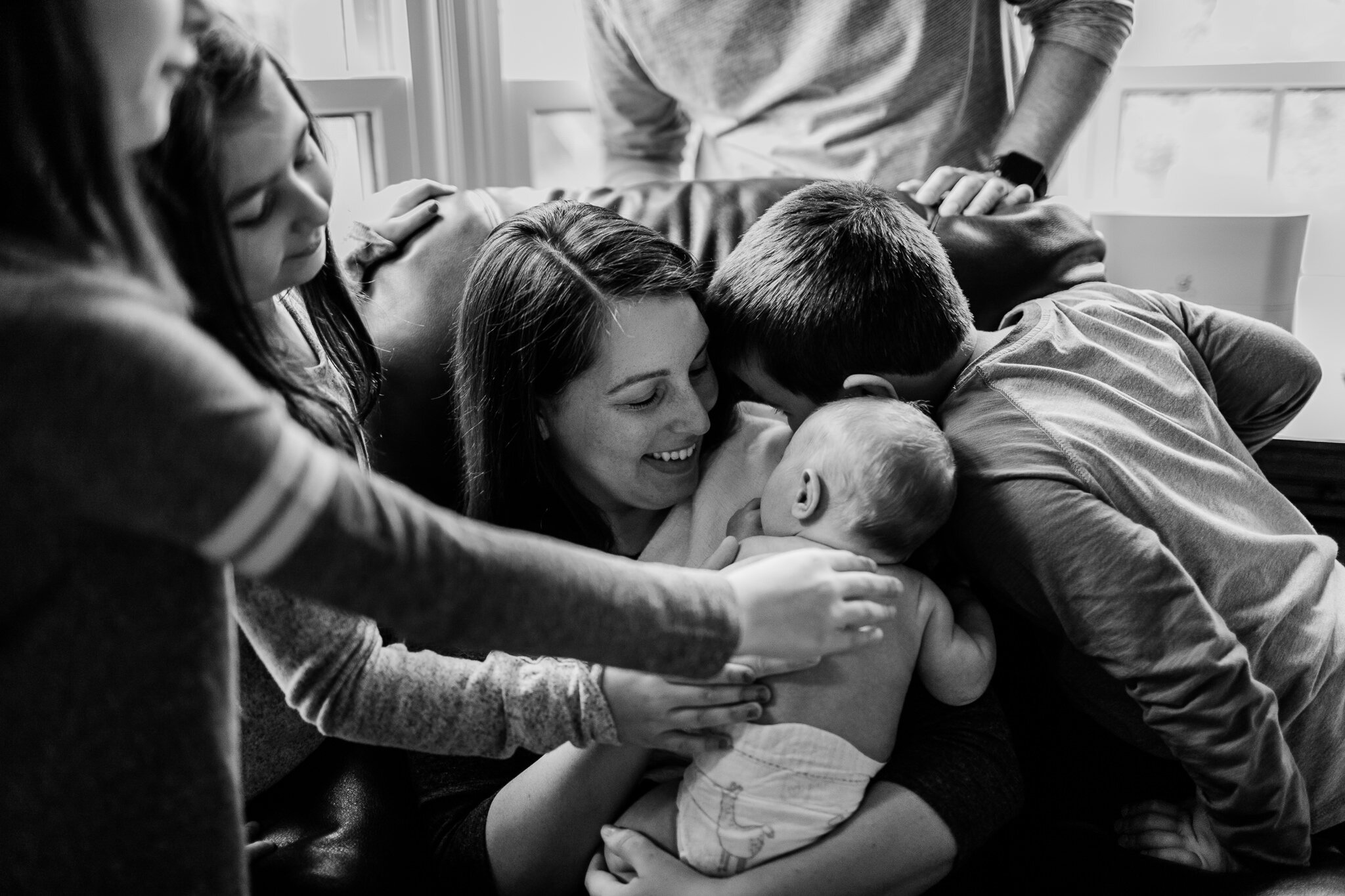 Raleigh Family Photographer | By G. Lin Photography | Lifestyle session at home | Siblings snuggling with mom and baby