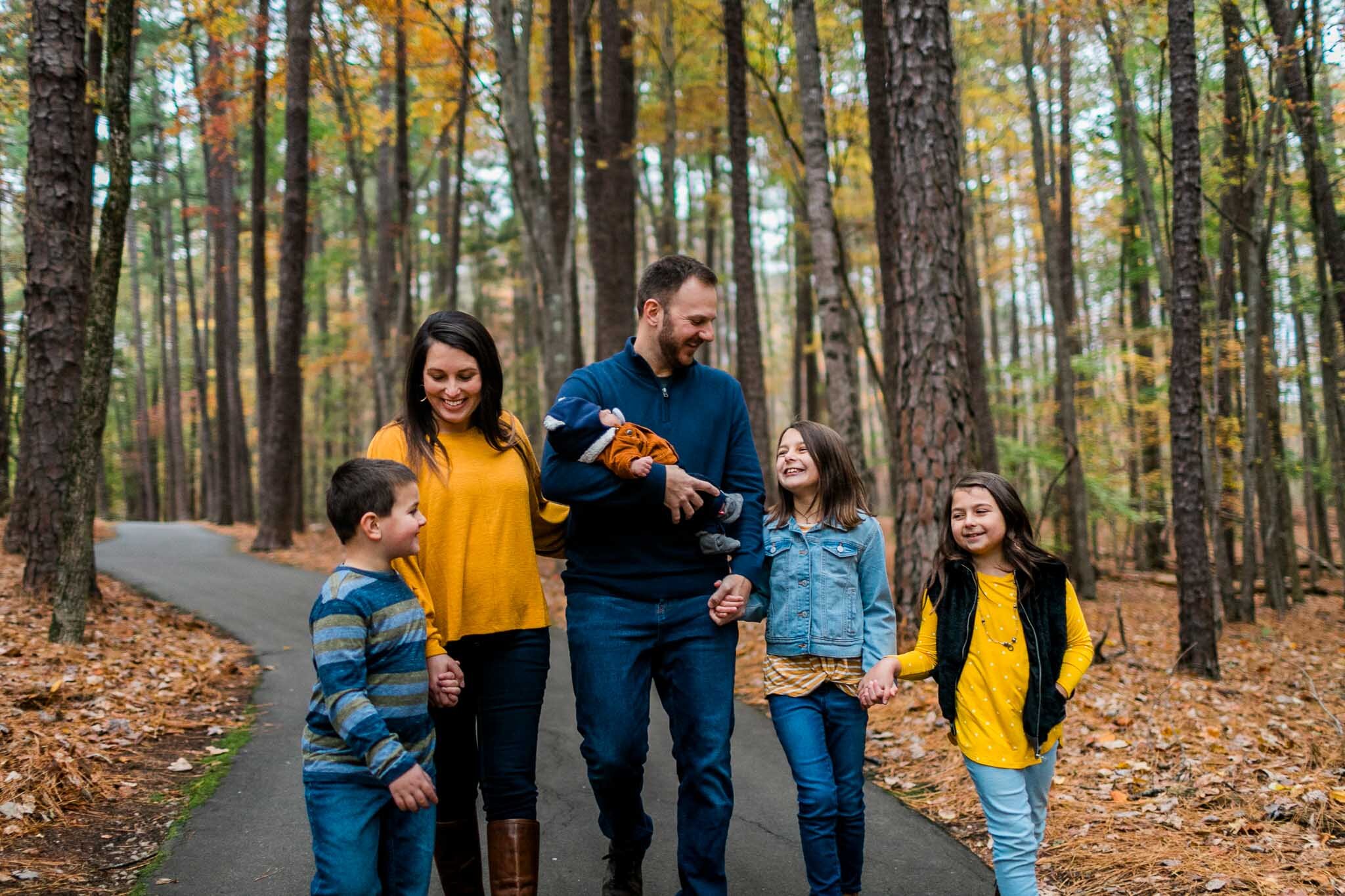 Raleigh Family Photographer | By G. Lin Photography | Family walking on trail at Umstead Park