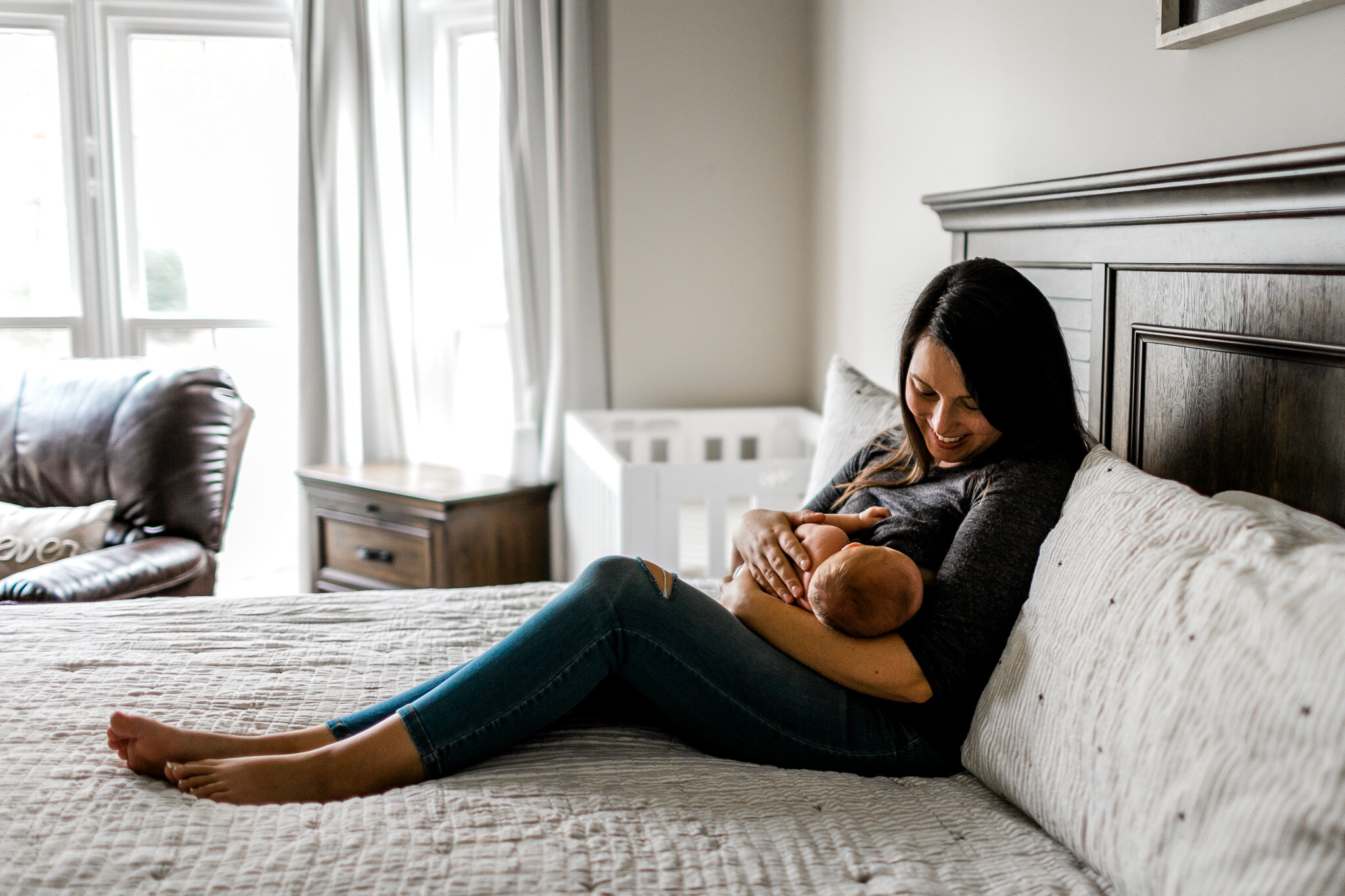Beautiful lifestyle newborn photo of mother breastfeeding baby | Raleigh Newborn Photographer | By G. Lin Photography