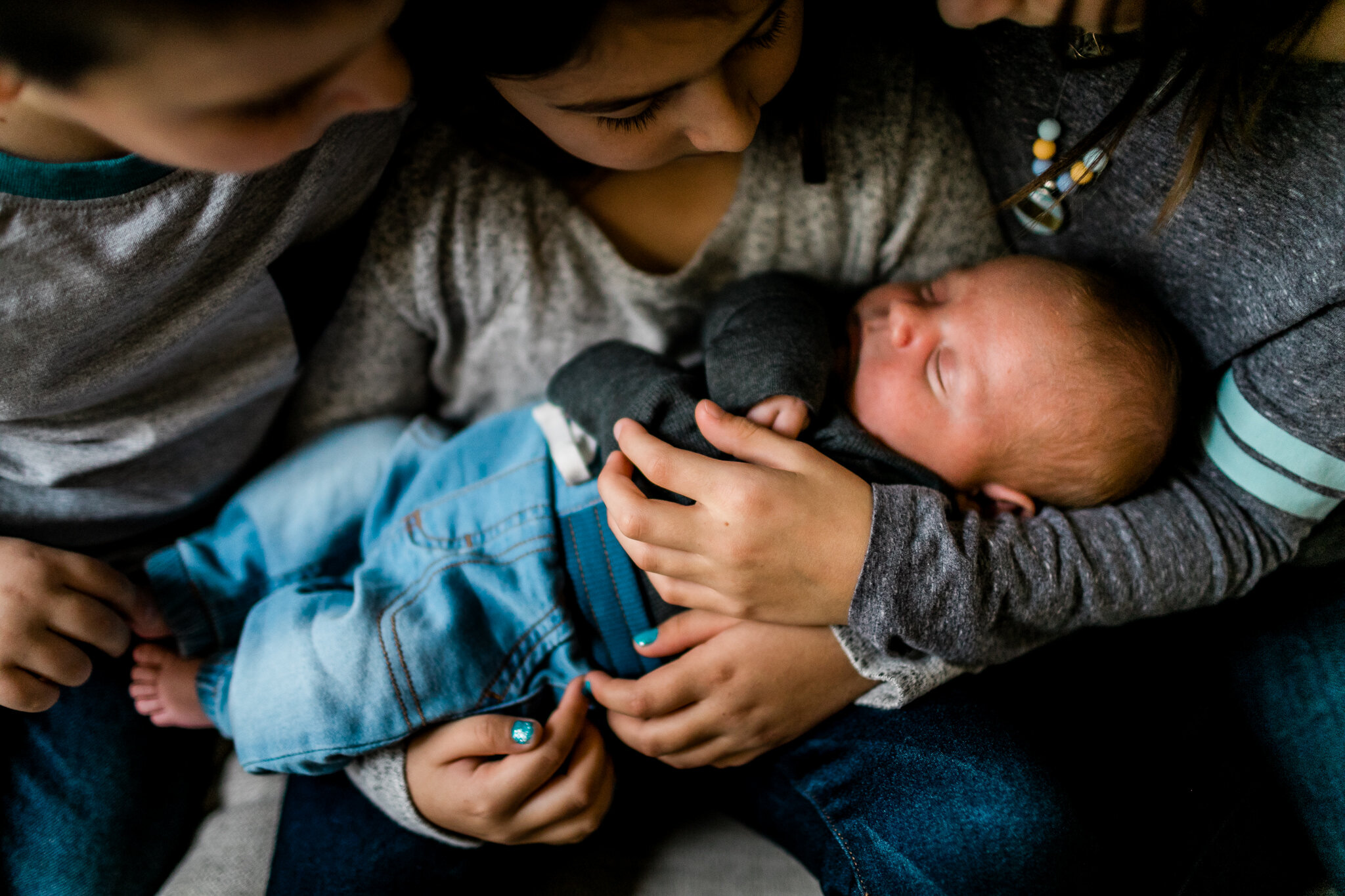 Raleigh Newborn Photographer | By G. Lin Photography | Siblings holding baby brother in lap