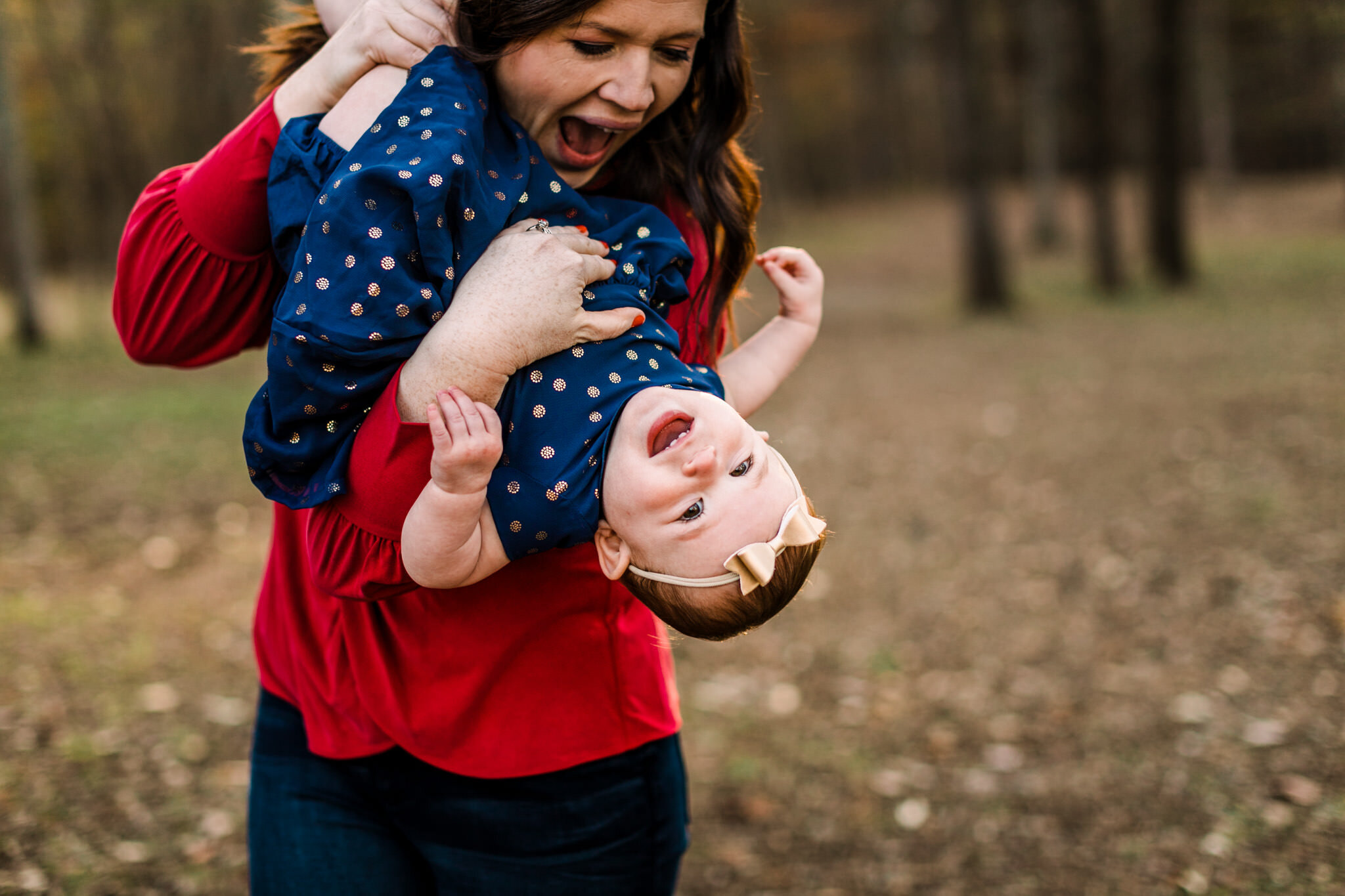 Durham Photographer | By G. Lin Photography | Mom tickling daughter outdoors | West Point on Eno River