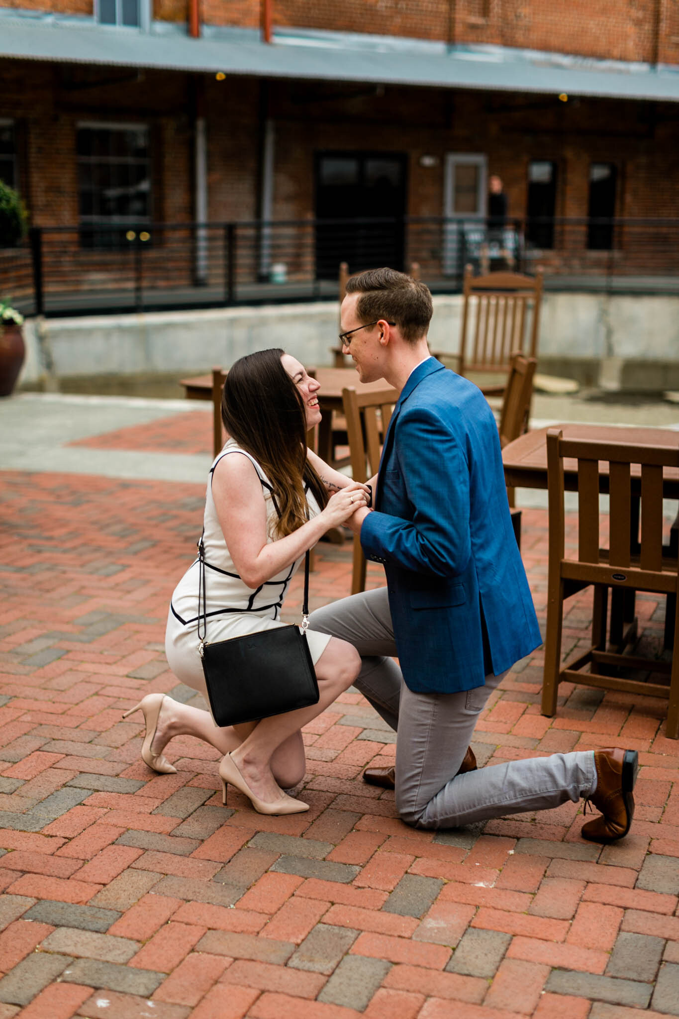 Durham Photographer | By G. Lin Photography | Couple laughing and smiling while on their knees during proposal