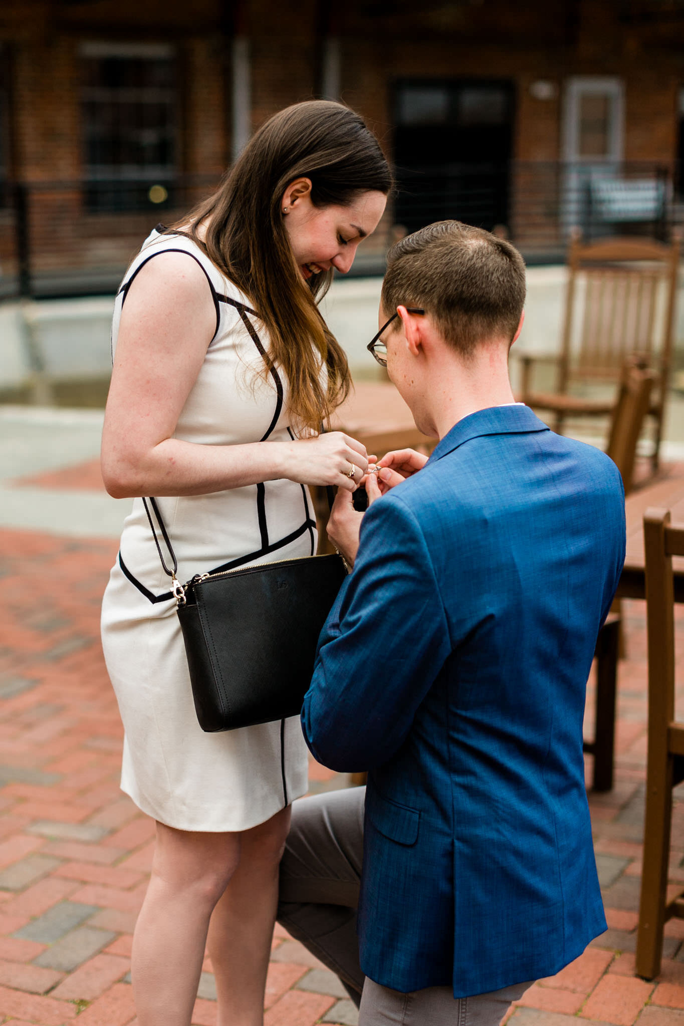 Man putting ring on woman | Durham Proposal Photographer | By G. Lin Photography