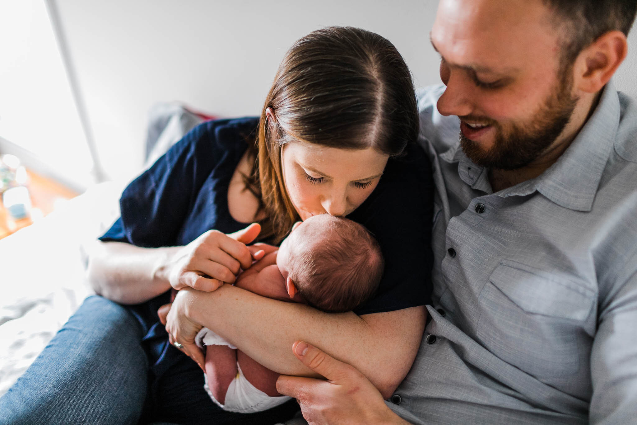 Raleigh Newborn Photographer | By G. Lin Photography | Mother kissing newborn baby on the head