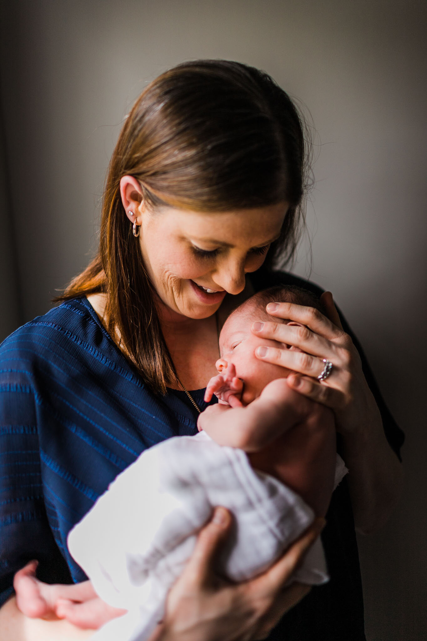 Raleigh Newborn Photographer | By G. Lin Photography | Mother holding baby daughter in her arms