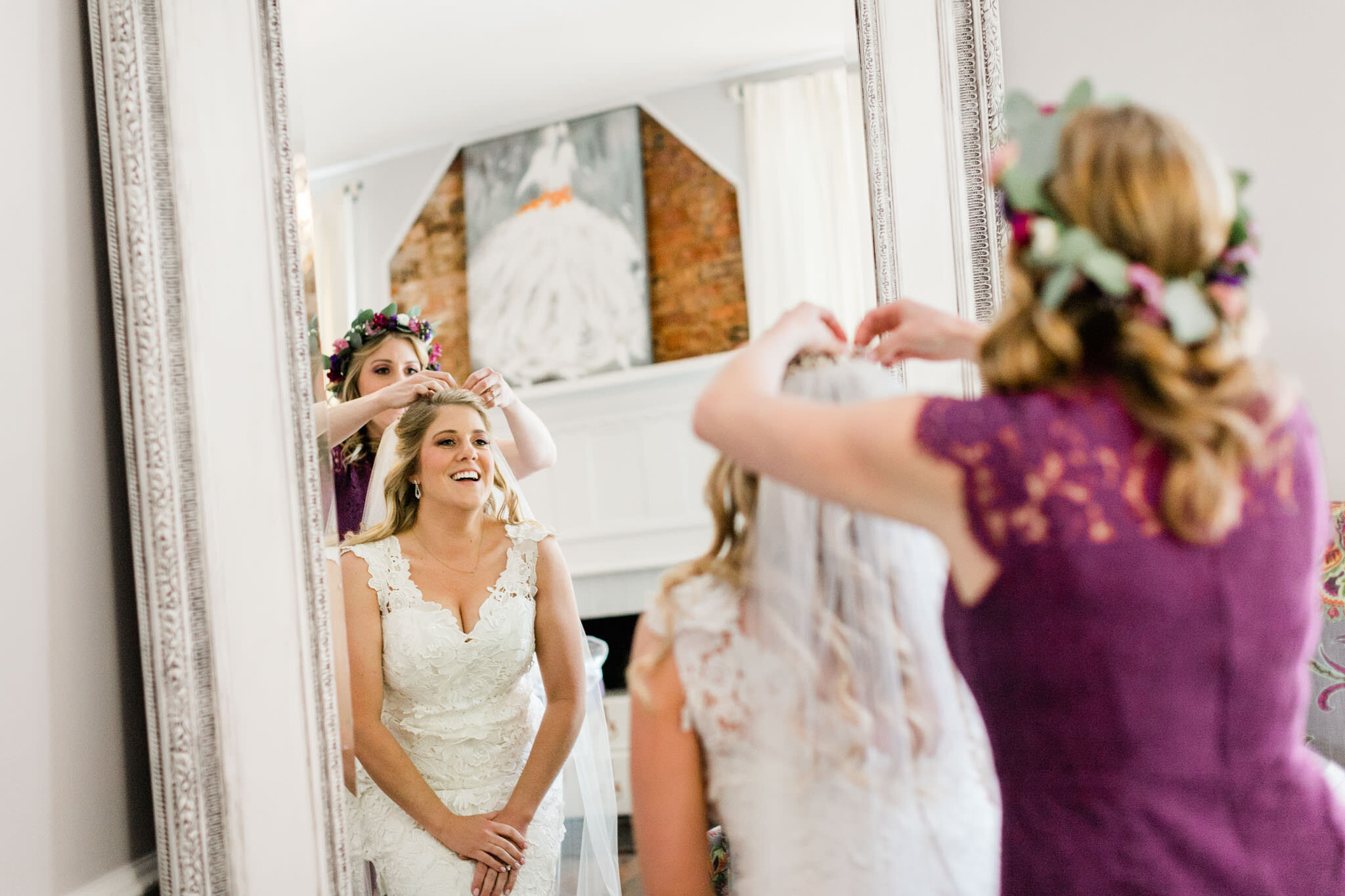 Durham Wedding Photographer | By G. Lin Photography | Bridesmaid putting veil on bride in front of mirror