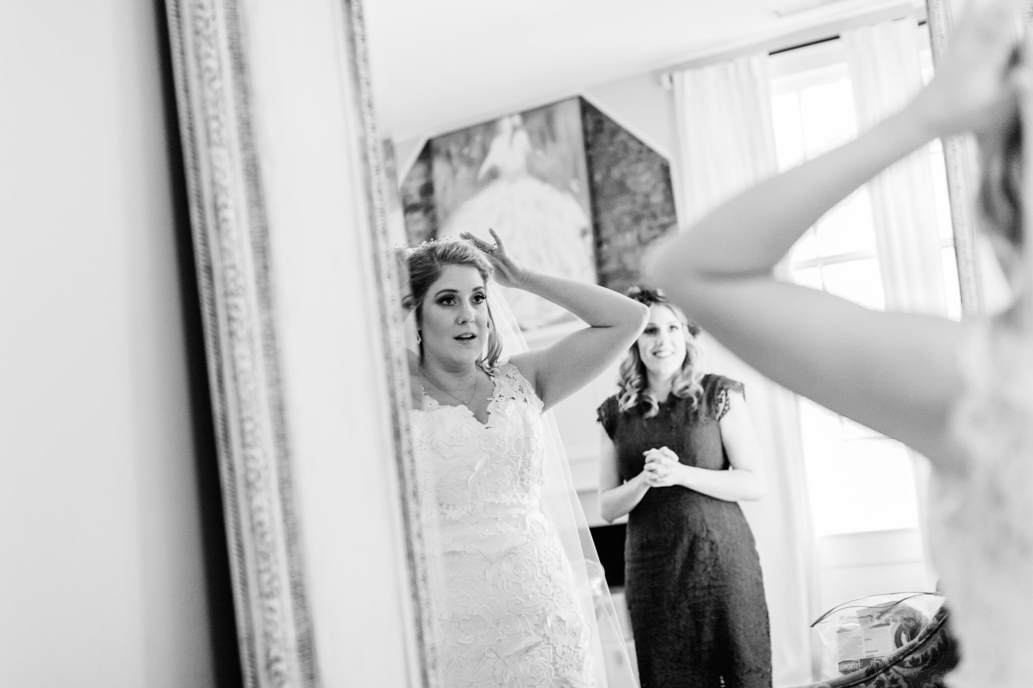 Durham Wedding Photographer | By G. Lin Photography | Bride adjusting her veil in front of mirror