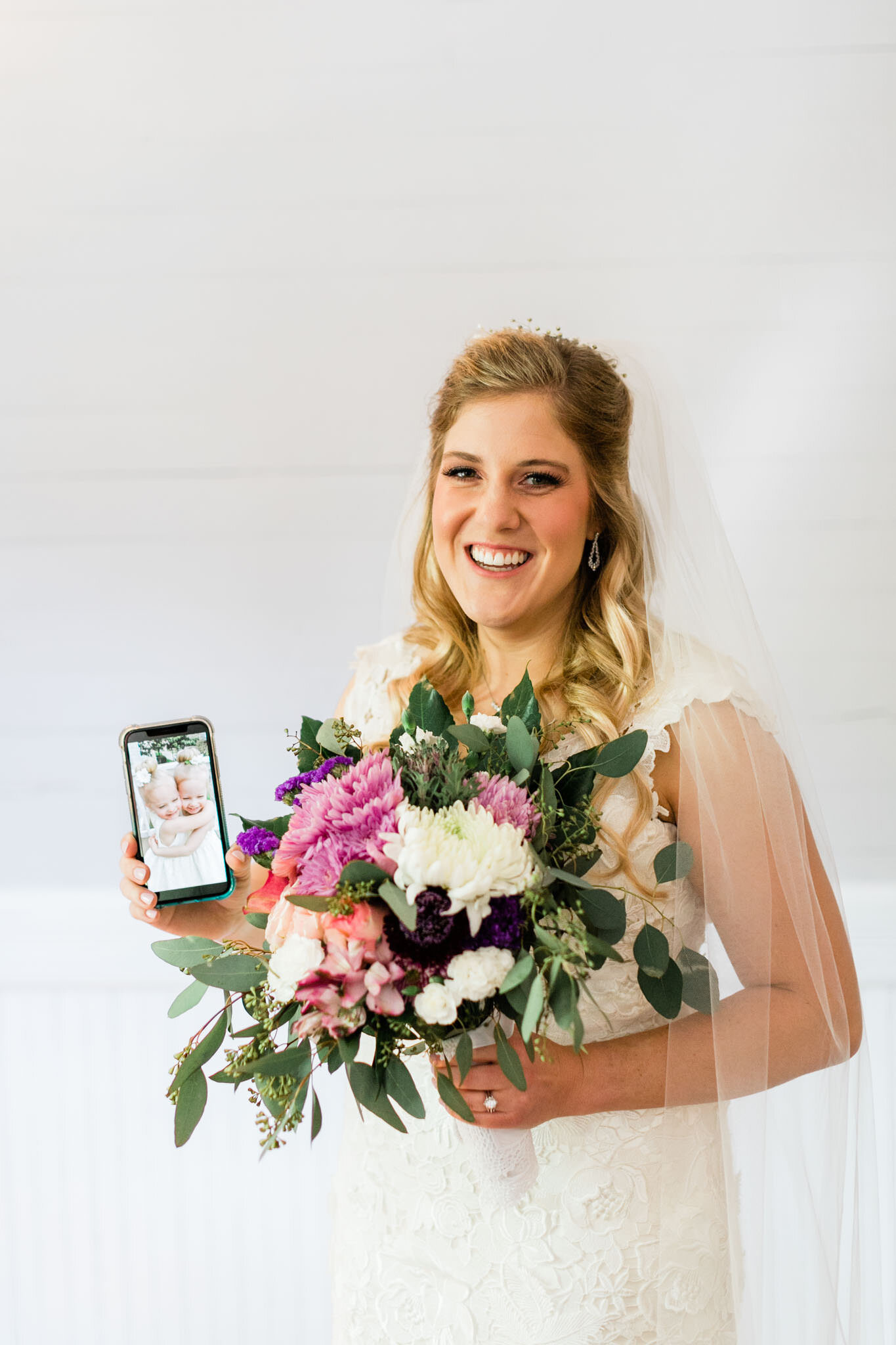 Durham Wedding Photographer | By G. Lin Photography | Portrait of bride holding cell phone picture