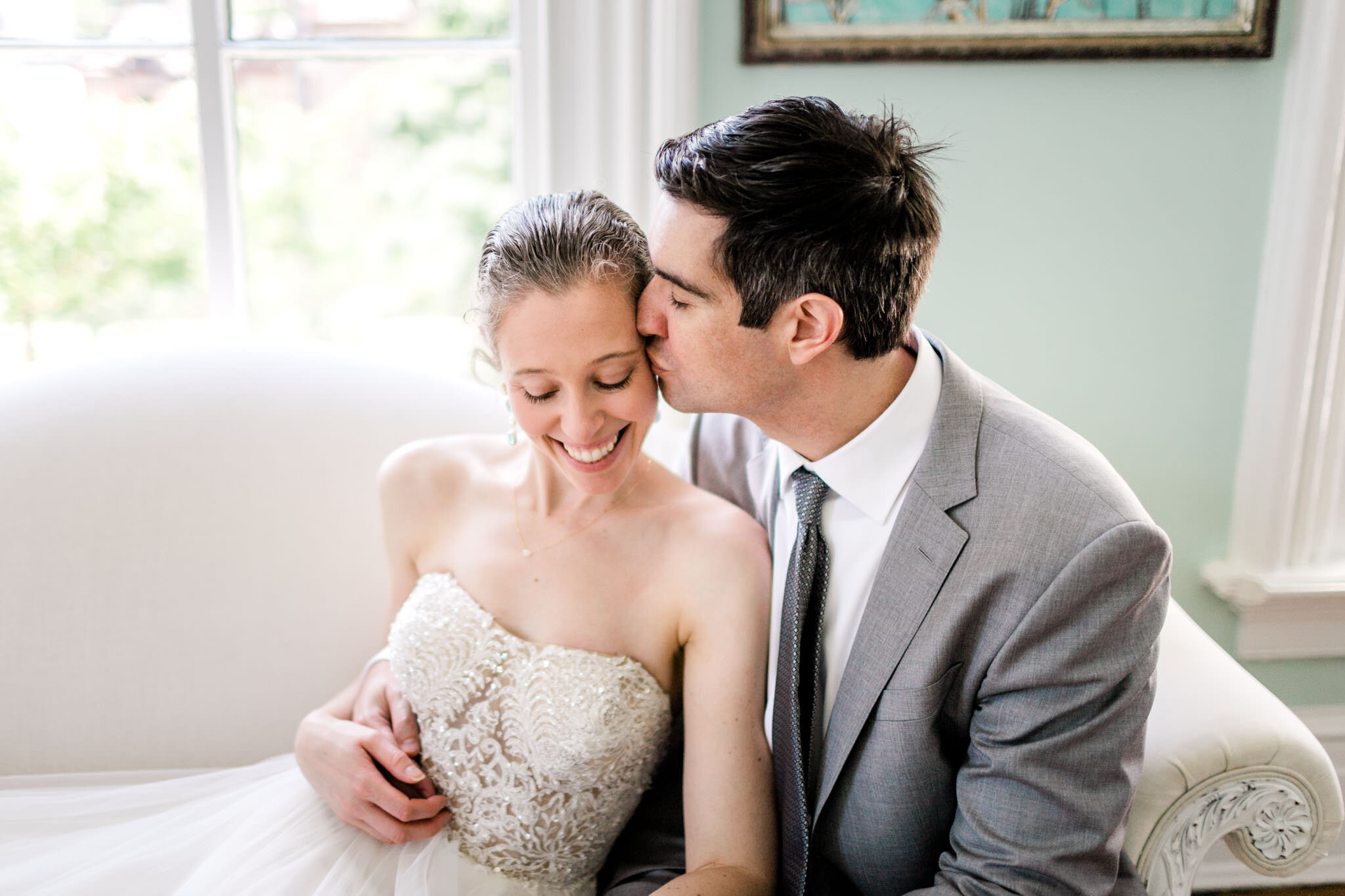 Raleigh Wedding Photographer | By G. Lin Photography | Merrimon Wynne House | Candid portrait of Bride and Groom on couch