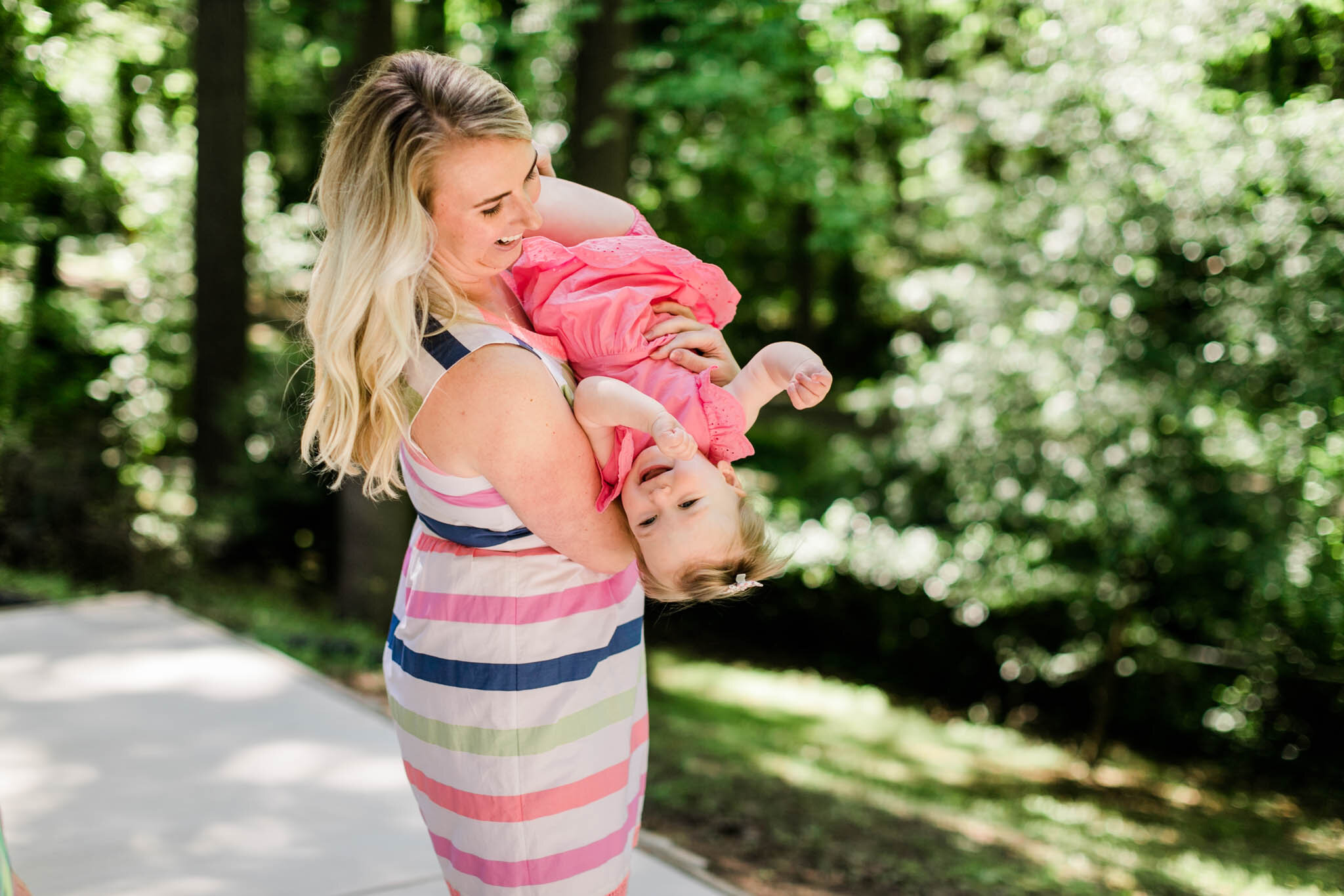 Raleigh Family Photographer | By G. Lin Photography | Mom holding daughter outside
