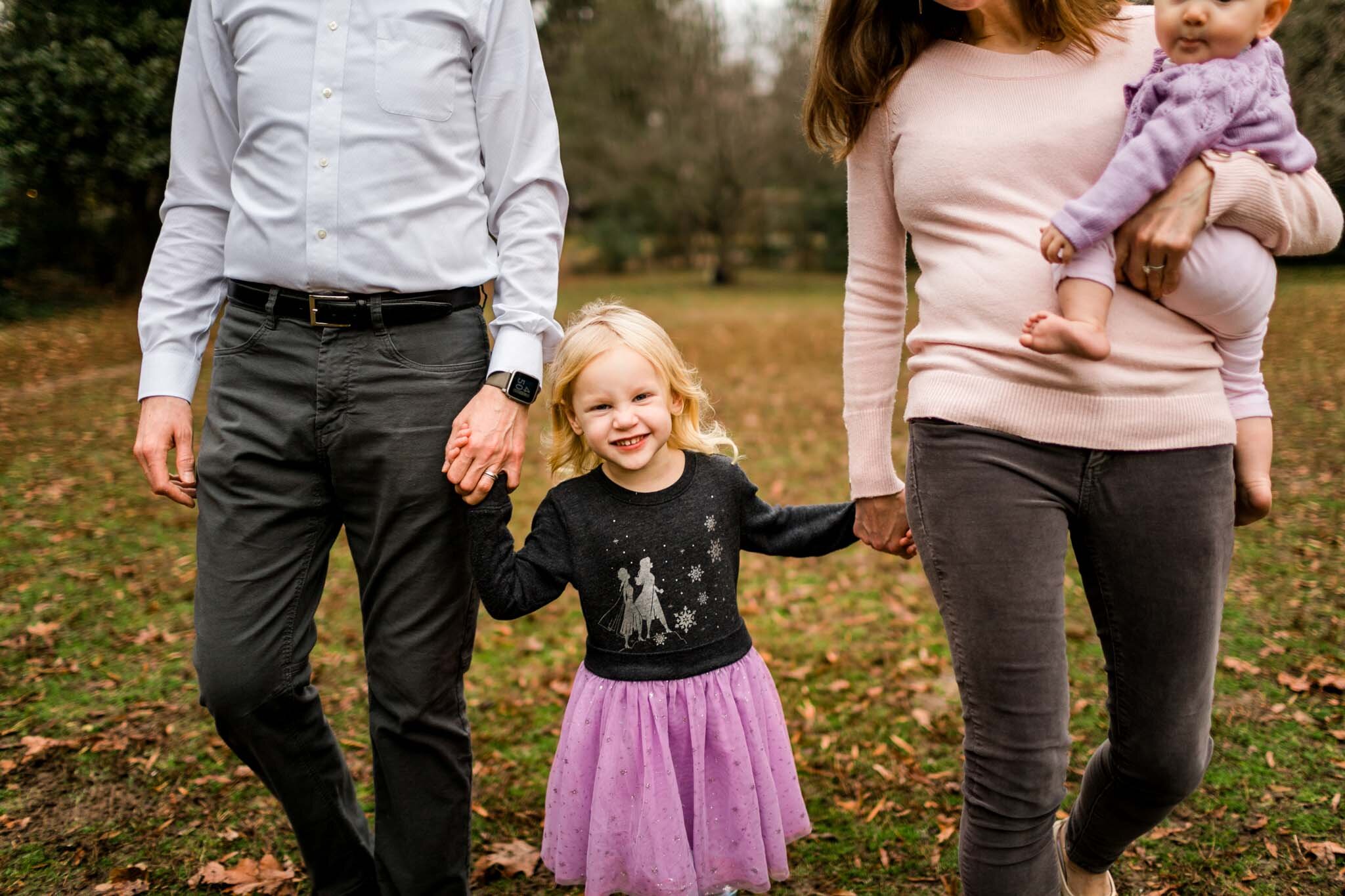Durham Family Photographer | By G. Lin Photography | Little girl holding her parents' hands and laughing