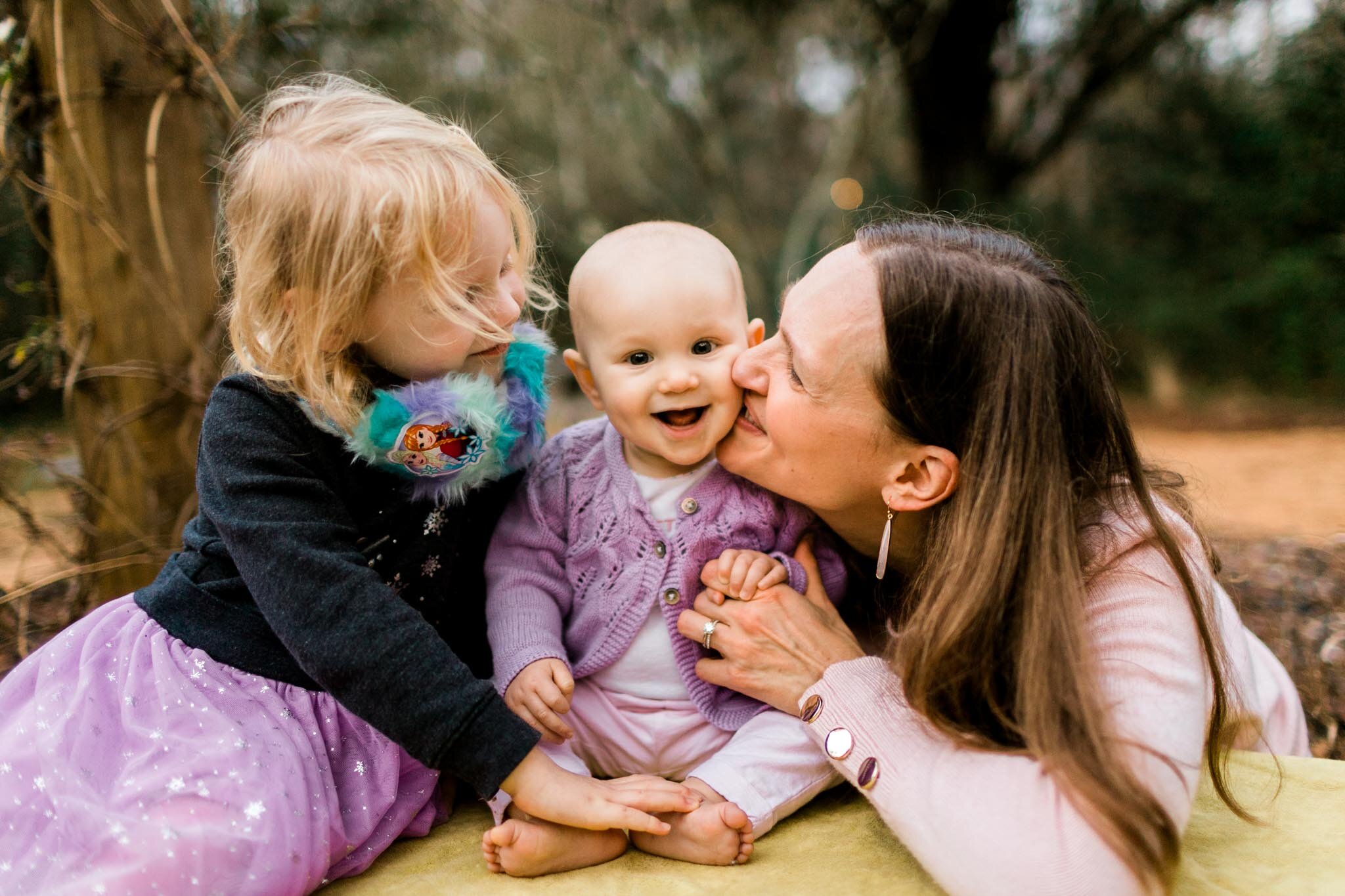 Durham Family Photographer | By G. Lin Photography | Baby sitting in the middle of sister and mom