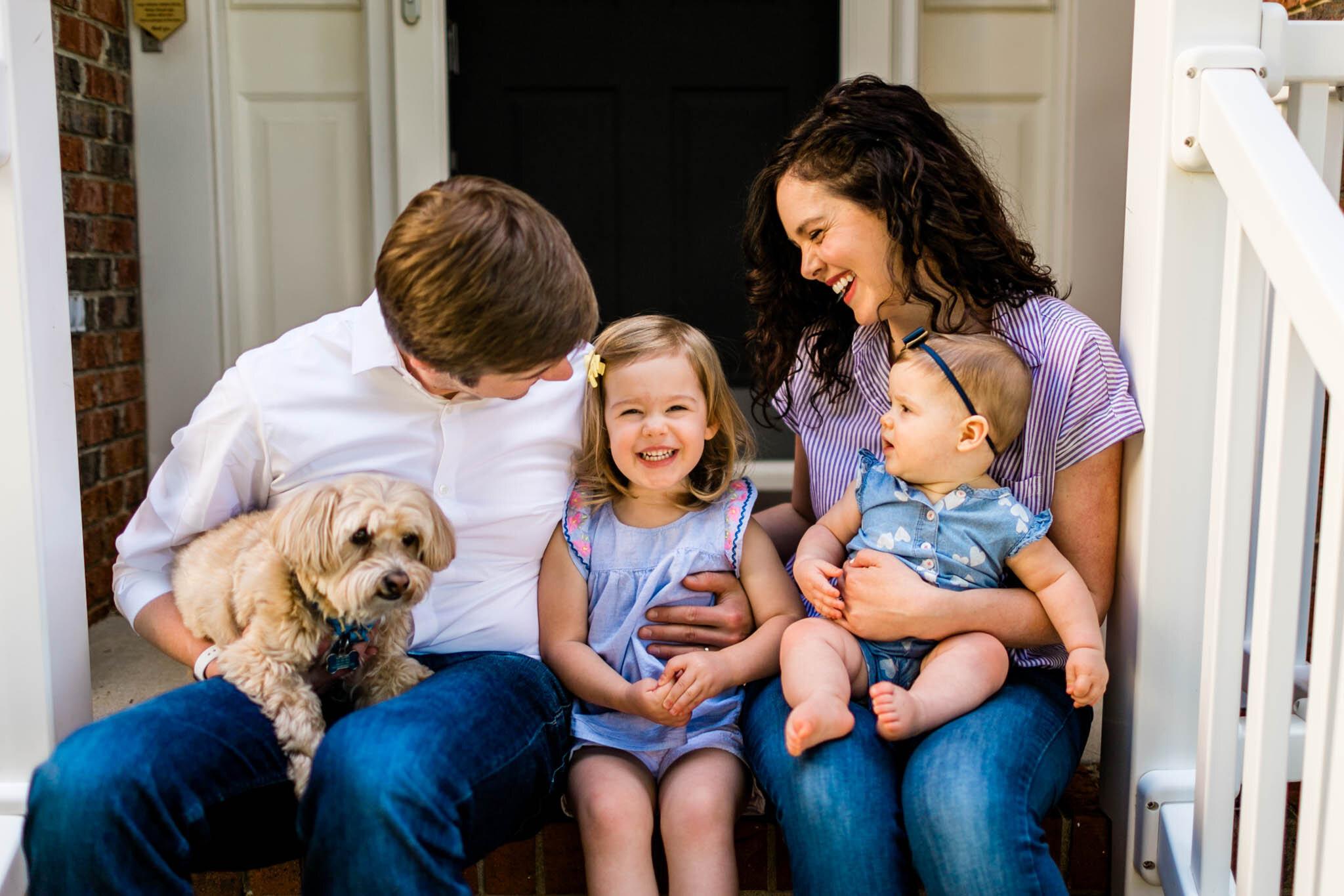 Raleigh Family Photographer | By G. Lin Photography | Porch portrait of family laughing together