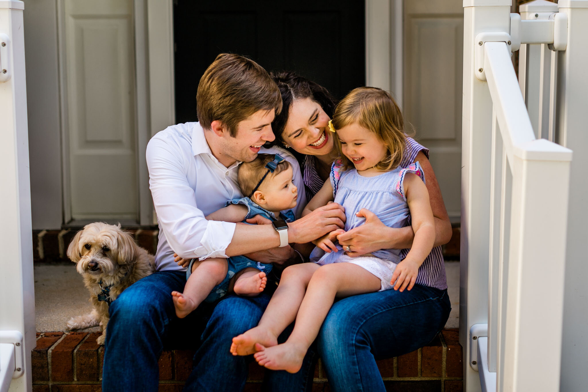 Raleigh Family Photographer | By G. Lin Photography | Porch portrait of family tickling daughter