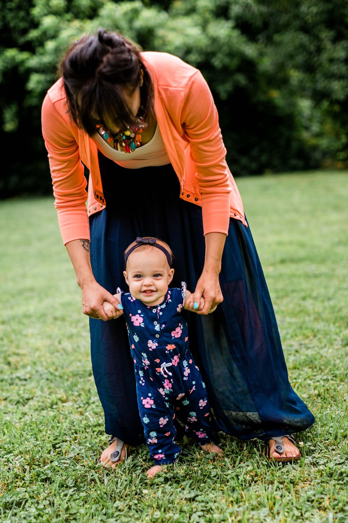Raleigh Family Photographer | By G. Lin Photography | Mother helping baby girl walking on grass