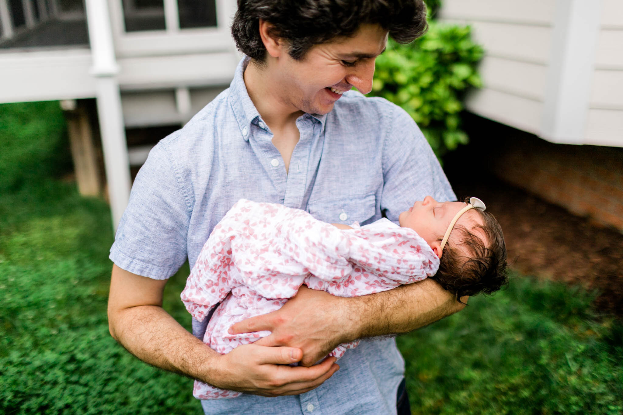 Durham Newborn Photographer | By G. Lin Photography | Father holding baby girl in arms outside