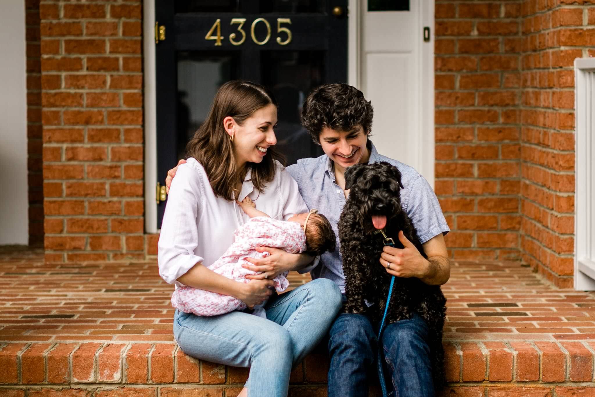 Durham Newborn Photographer | By G. Lin Photography | Family sitting outside with baby and dog