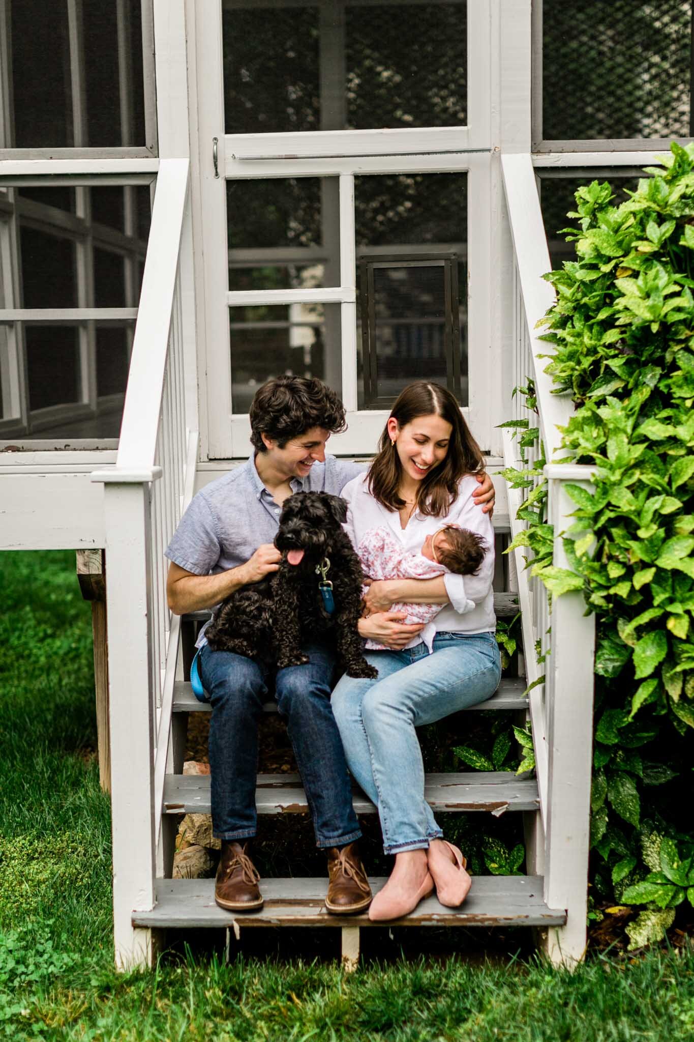 Durham Newborn Photographer | By G. Lin Photography | Family sitting on back porch with baby in lap