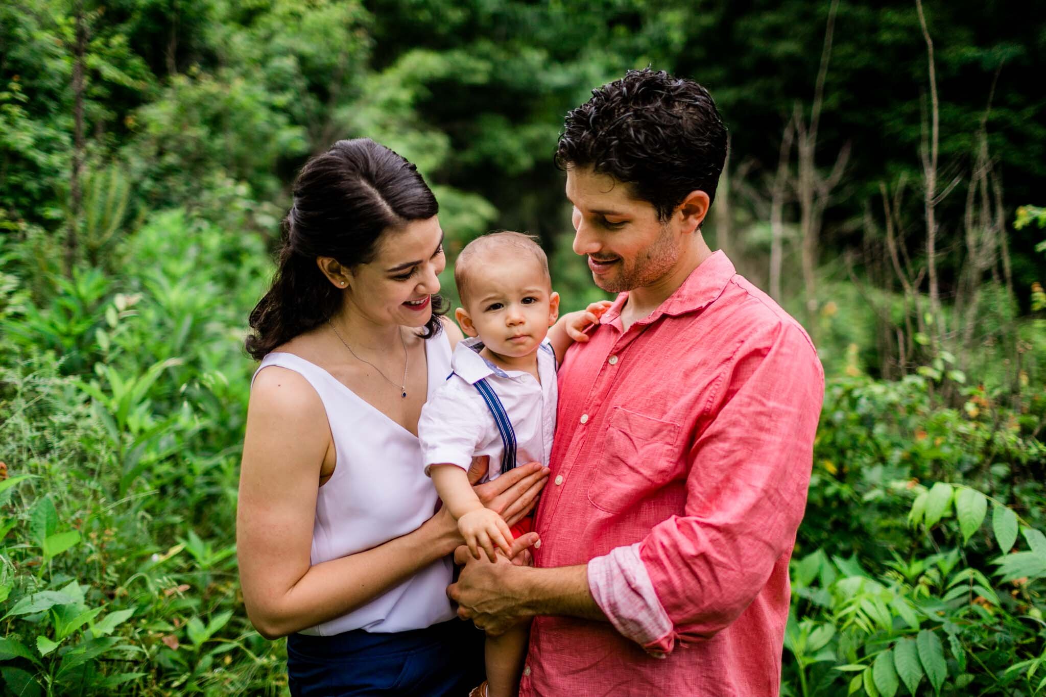 Raleigh Family Photographer | By G. Lin Photography | Mom and dad holding baby boy in arms