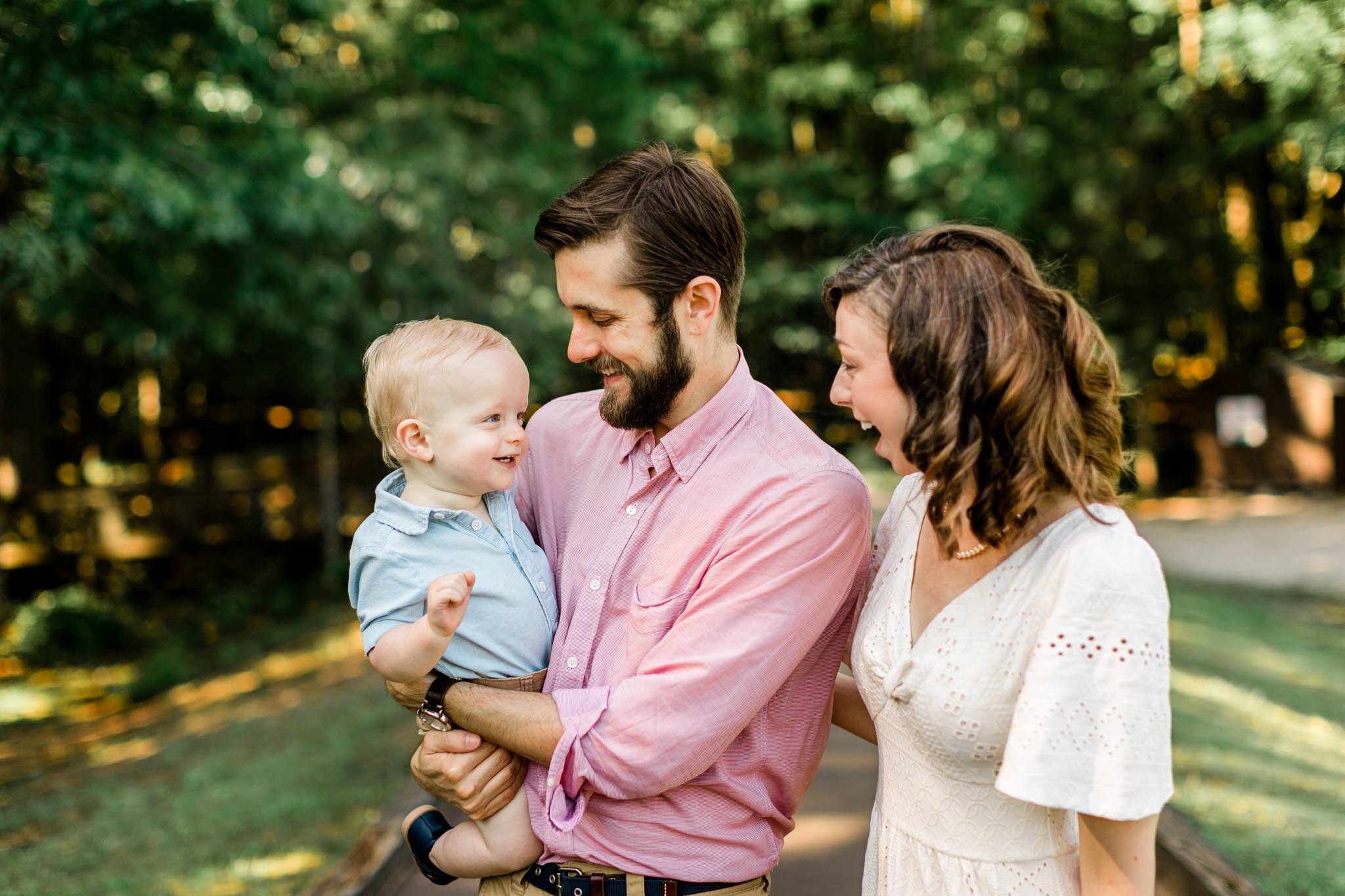 Raleigh Family Photographer | By G. Lin Photography | Umstead Park | Candid family photo laughing in park