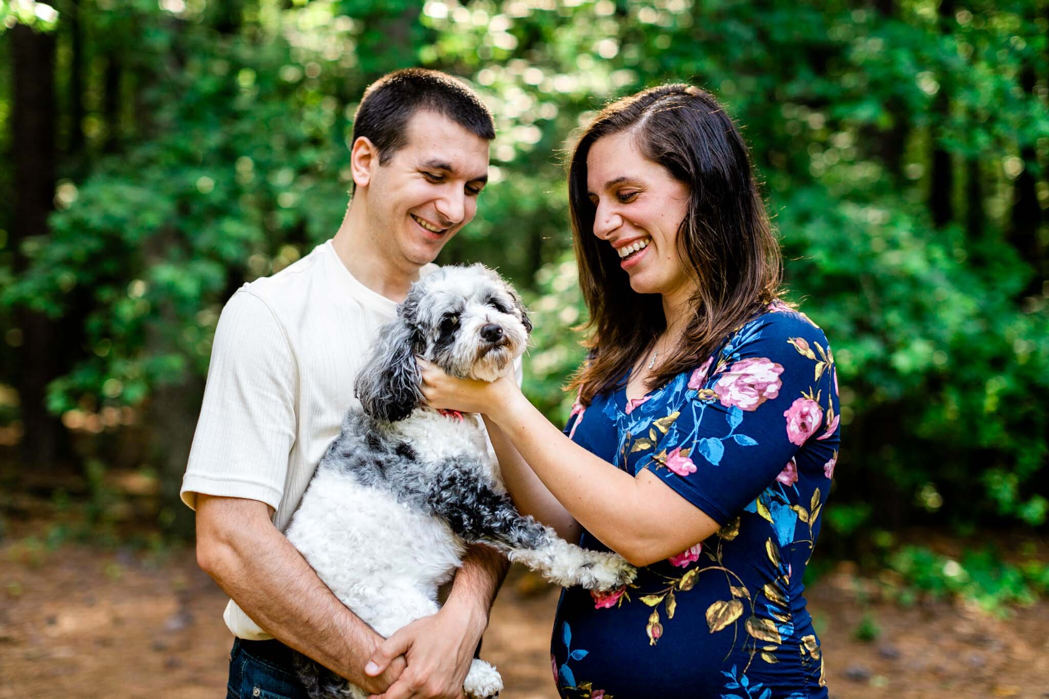 Raleigh Maternity Photographer | By G. Lin Photography | Umstead Park | Couple petting dog and laughing